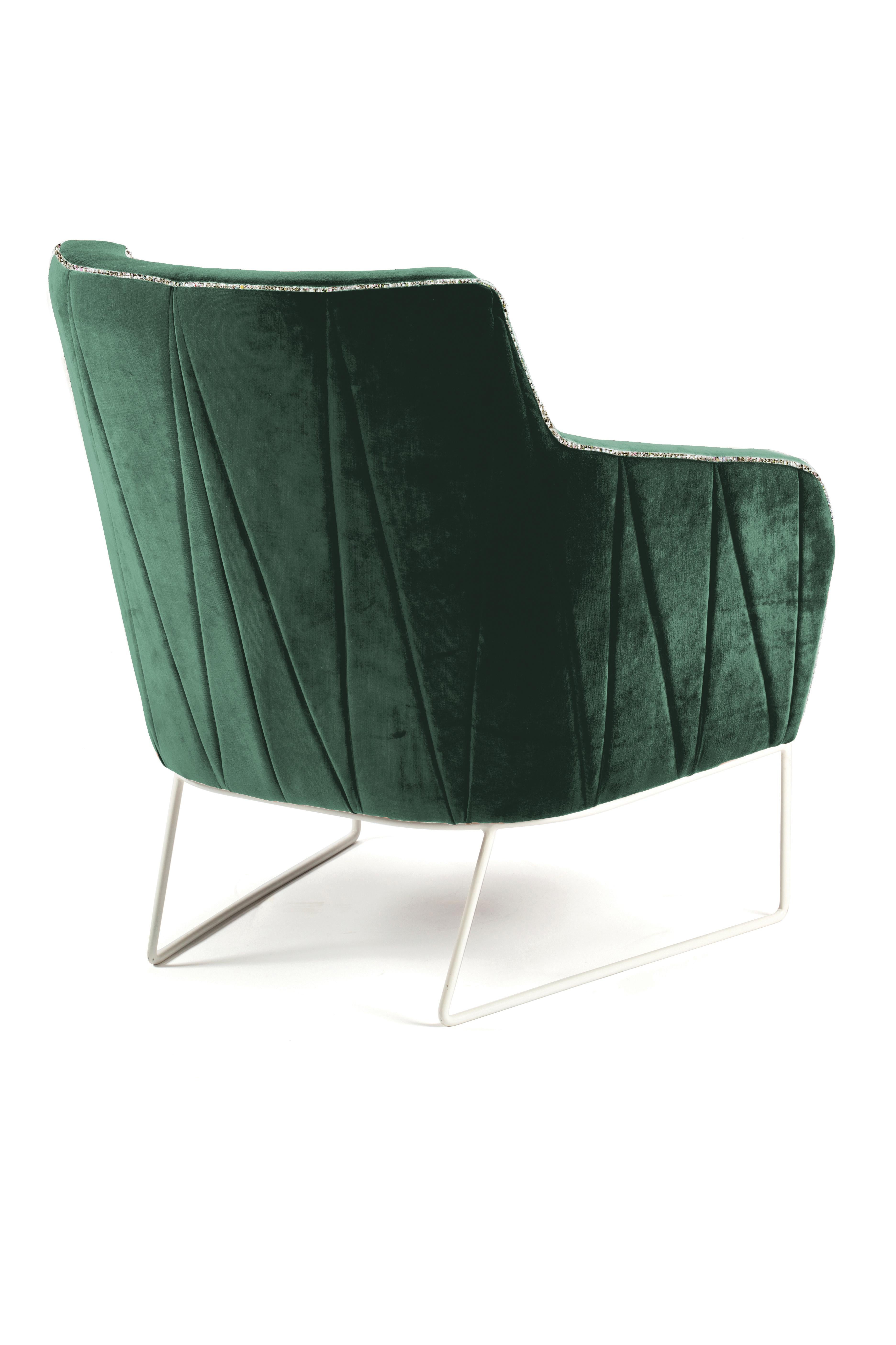 Delicate seaming in diagonal shapes throughout Croix upholstered back contrast with the smooth seating. Stylish and elegant, this armchair is extremely comfortable in its’ perfect finishing’s. With each fabric and metal base lacquer combination it