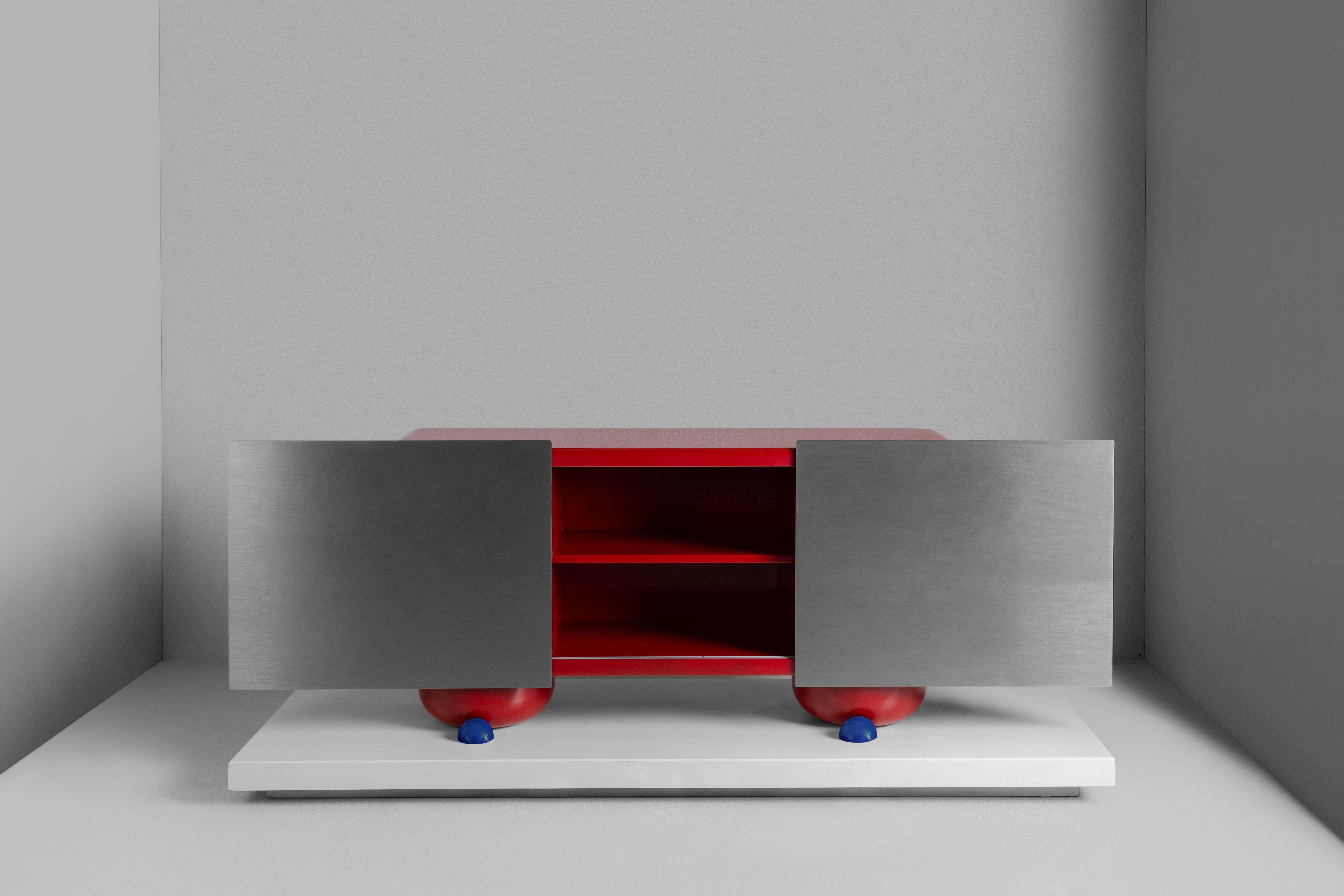 Cromo (II) Console by Breuer
Dimensions: D 52 x W 180 x H 85 cm.
Materials: High-gloss lacquered wood, steel.

Cromo is inspired by the duality of nature and technology. This collection is characterized by its ability to capture the essence of pure