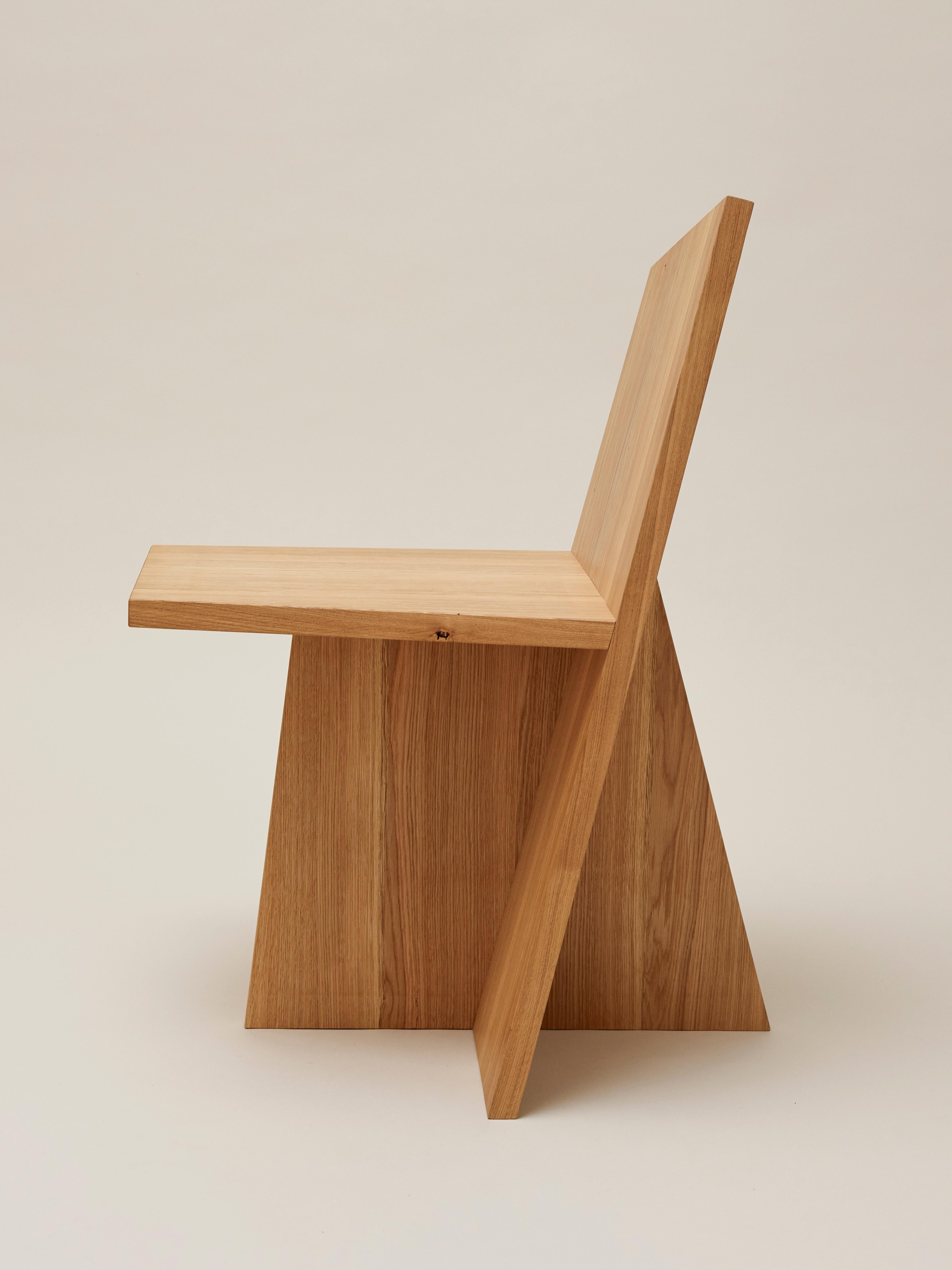 Crooked dining chair by Nazara Lázaro
Dimensions: H 86 x W 53 x D 58 cm 
 Seat height: 45 cm
Materials: Massive oak with oil wax surface

All pieces are available in natural massive oak, walnut and white lacquered wood.
Additional sizes, woods