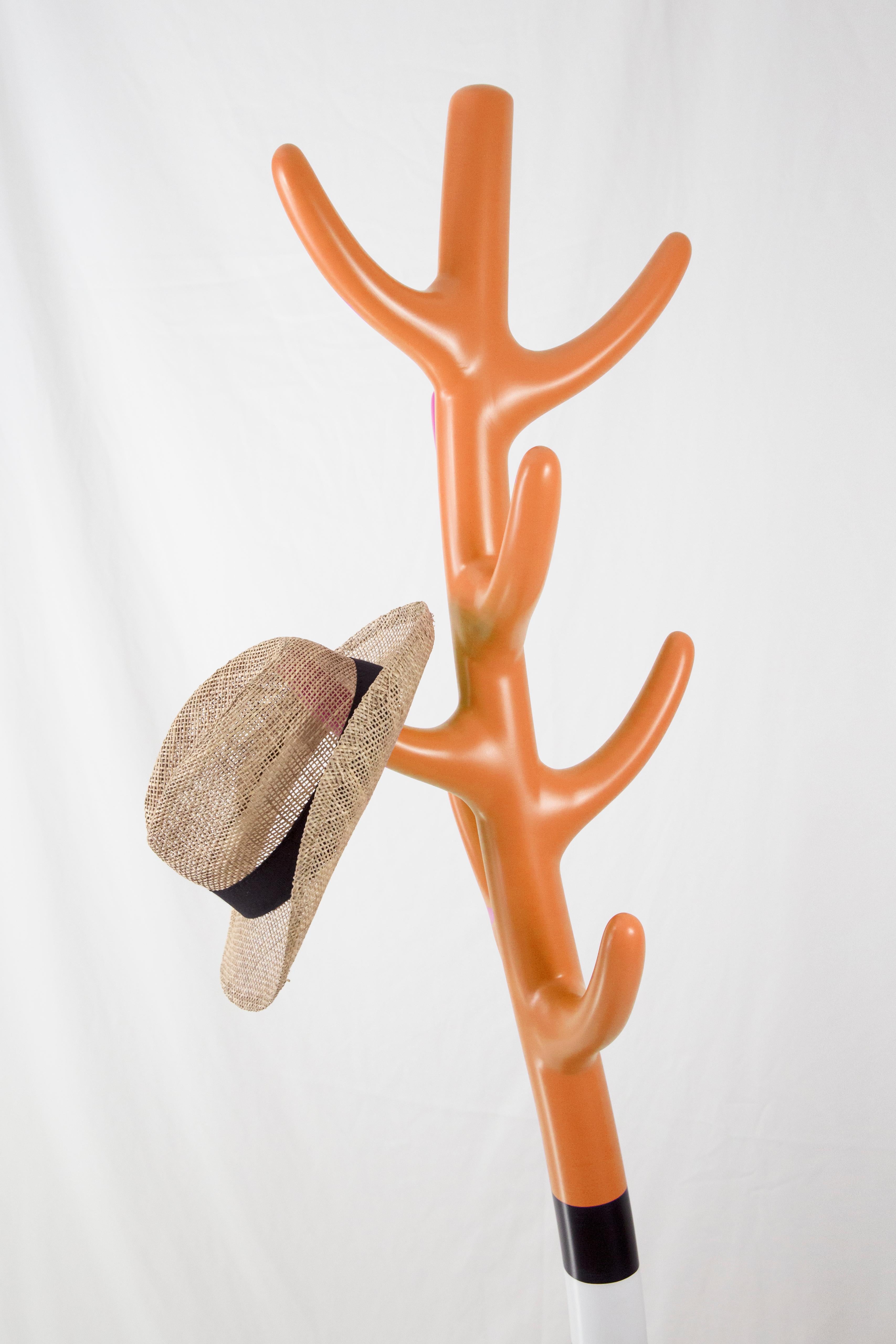 Overview:
Transform your entryway or living space with the Crooked Coat Rack, a sculptural piece that combines functionality with artistic flair. Crafted with an amorphous design, this vibrant orange coat rack doubles as a striking art object that