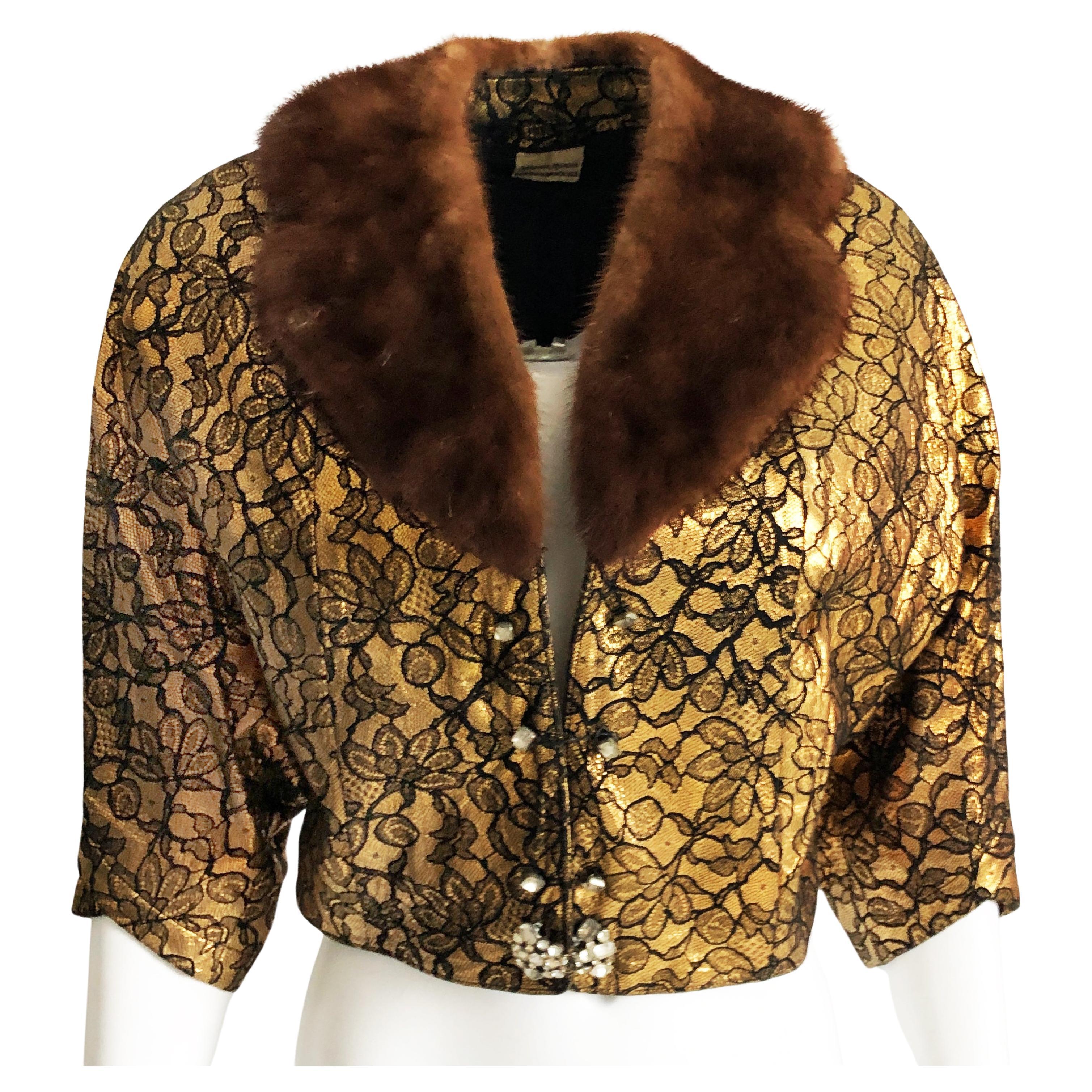 Be retro-fabulous in this preowned, vintage gold and black jacket, sold by Neiman Marcus Trophy Room, most likely in the 1950s.  Made from what we believe is gold leather (no content label), it's embossed with a decorative black floral and net