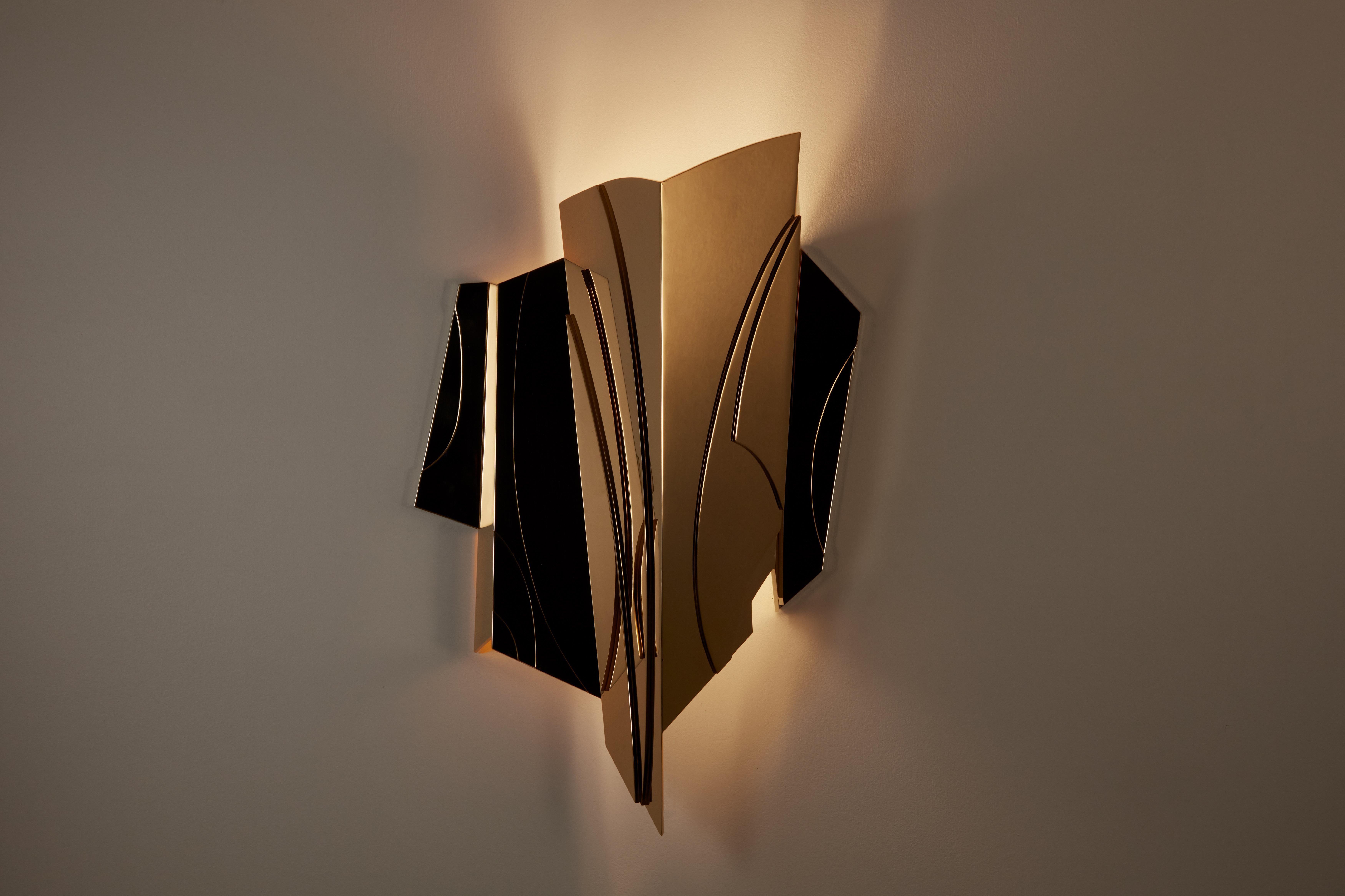 Cross Bitume wall lamp by Mydriaz
Dimensions: D14 x W 27 x H 45 cm
Materials: Brass polished pale gold, LED strip.

Our products are handmade in our workshop. Dimensions and finishes may vary slightly from one model to another dimensions can be