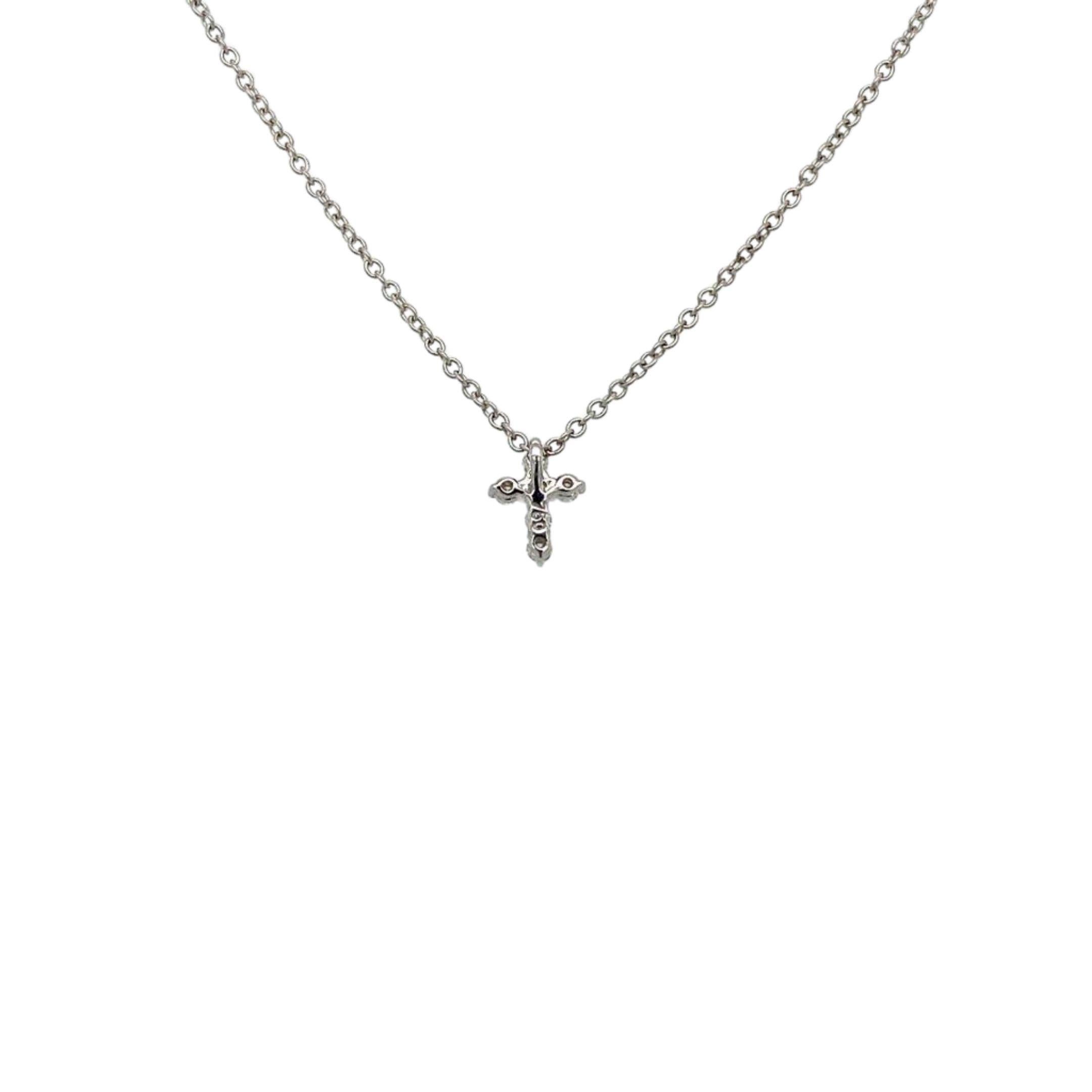 Cross Diamond Pendant Necklace made with real/natural brilliant cut  diamonds. Diamond Weight: 0.12 carats. Mounted on 18 karat white gold.