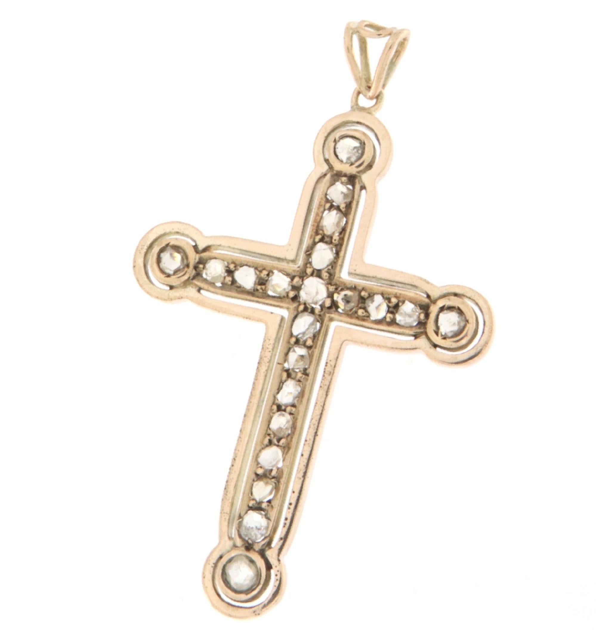 This exquisite 1940s cross pendant, crafted in 9-karat yellow gold, carries the unchanged luster of years past. Set with old-cut diamonds, each stone is masterfully embedded, enhancing the iconic shape of the cross with a glow that captures both