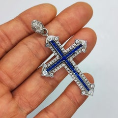 Cross diamonds sapphires 18 kt white gold