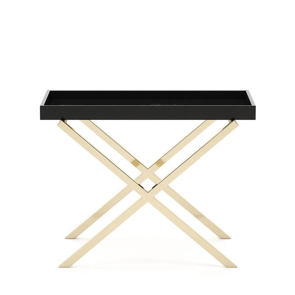 Side table cross gold legs with varnished
black oak top. With polished stainless steel
cross base in gold finish.