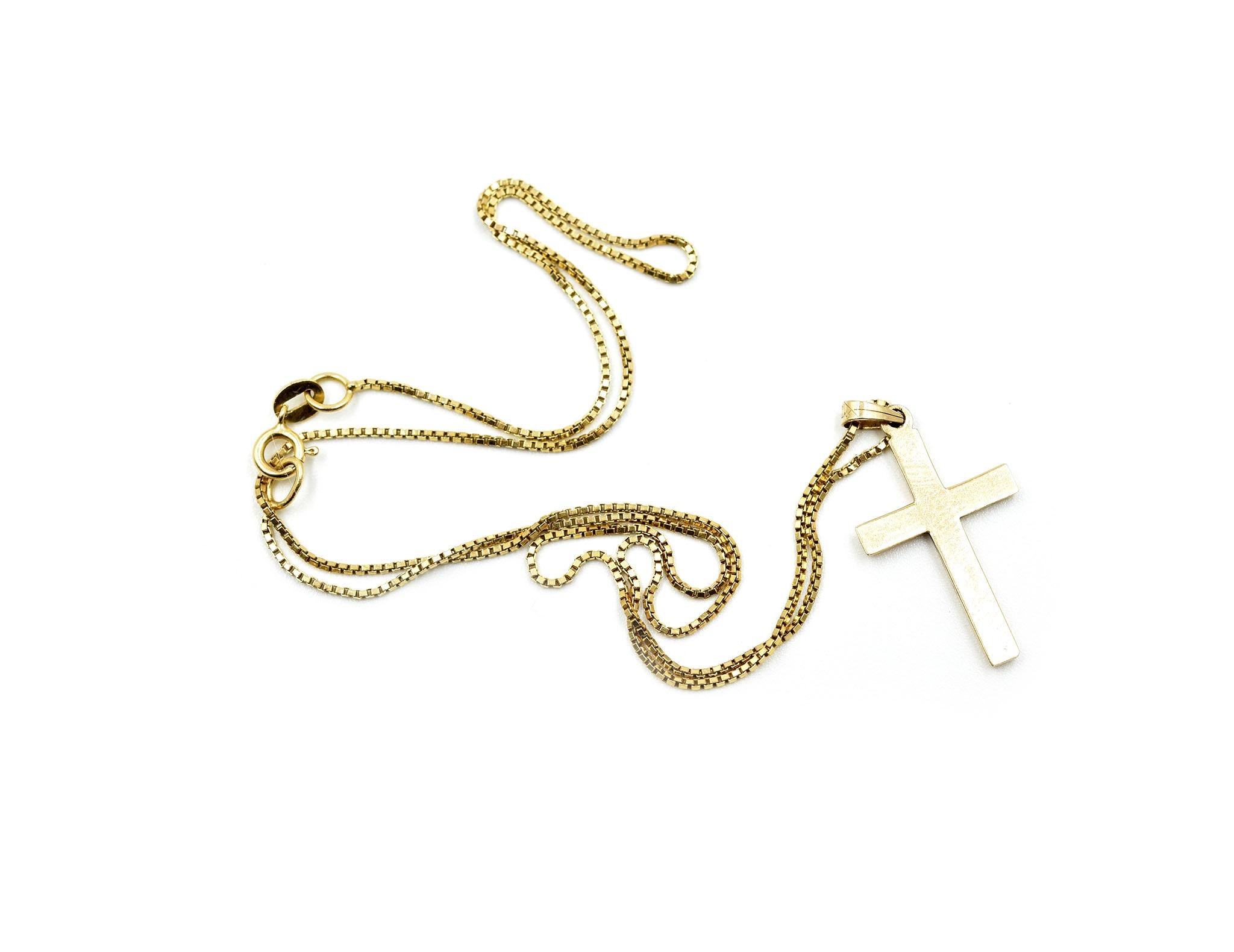 Designer: custom design
Material: 14k yellow gold
Dimensions: cross measures 3/4-inches long and 1/2-inches wide, necklace measures 16-inches long
Weight: 2.40 grams
