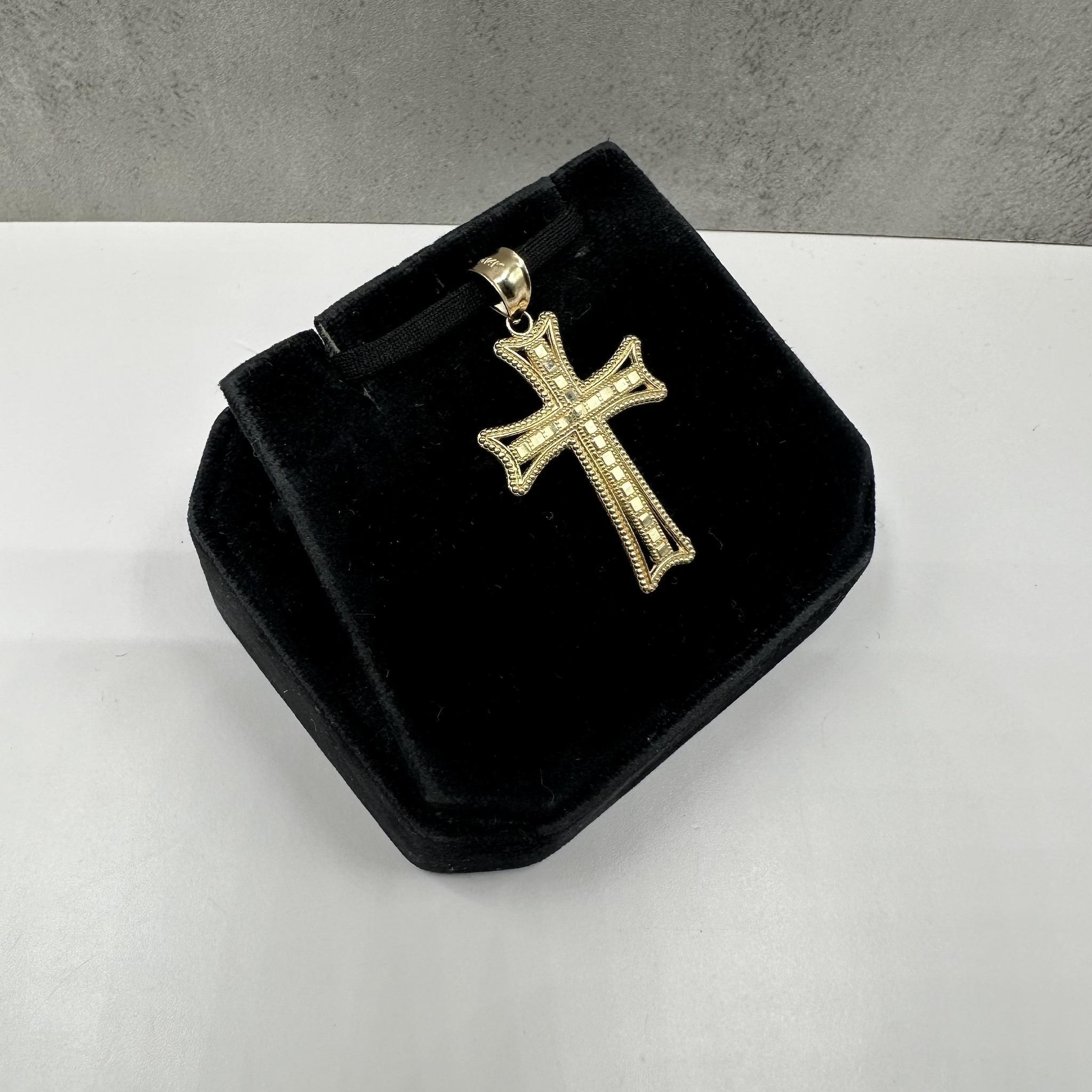 This classic cross pendant in 14kt yellow gold showcases a timeless and elegant design, symbolizing faith and devotion. Crafted with a polished finish, it radiates warmth and sophistication, making it perfect for everyday wear or special occasions.