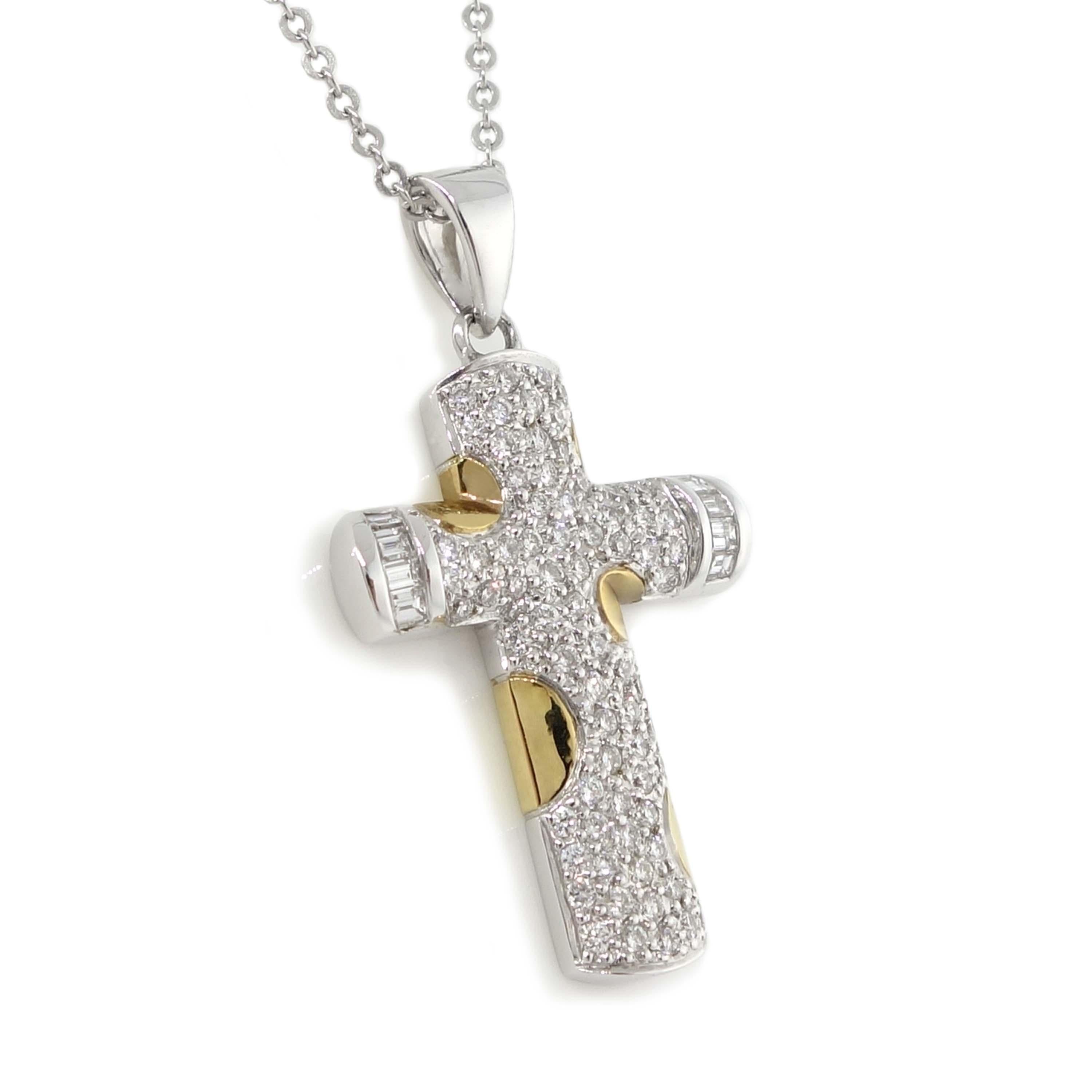 Cross pendant including 8 baguette diamonds of about 0.15 carats and 71 round brilliant cut diamonds of about 0.46 carats with a clarity of SI and color G. All diamonds are set in 18k 2 tone (White & Yellow). The total weight of the pendant is