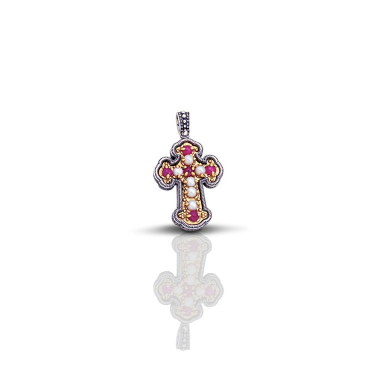 An impressive piece from the Dimitrios Exclusive crosses collection. A sterling silver cross pendant with pearls and rubies and oxidation on the back side.
A cross jewelry for any age inspired by the modern era that can be worn at any time of the