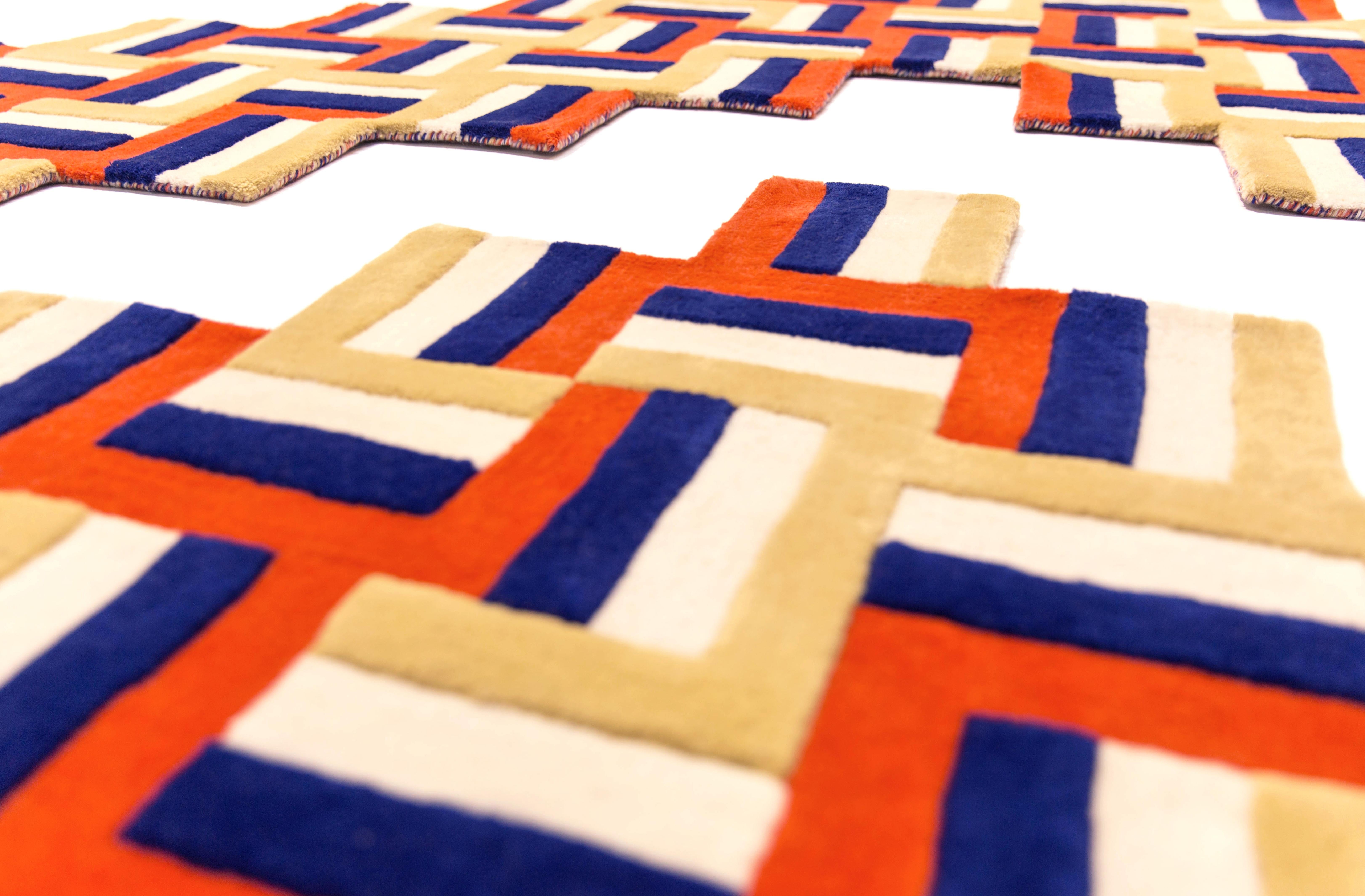 Cross is an innovative rug system with graphic lines. Inspired by a giant crossing
of colorful stripes, it is made of different square units which layout and number
will determinate the size and shape of the rug. The elegant mix of navy