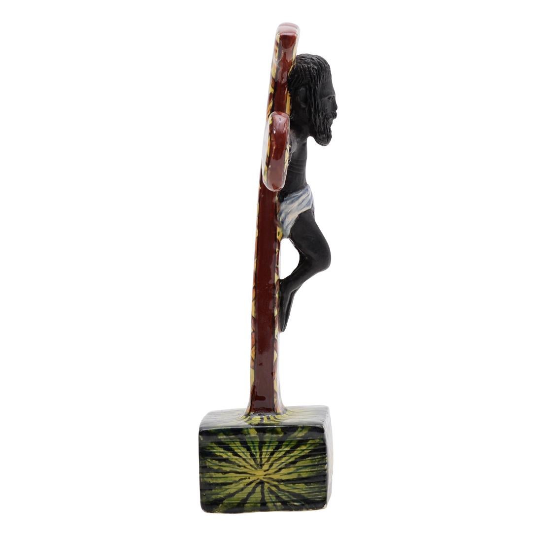 Cross Sculpture by Ardmore Ceramics. Hand sculpted by Mohanyane Khomari and hand painted by Zola Mweli in South Africa. Measuring 8 inches high 2 inches in length and 2 inches in width.