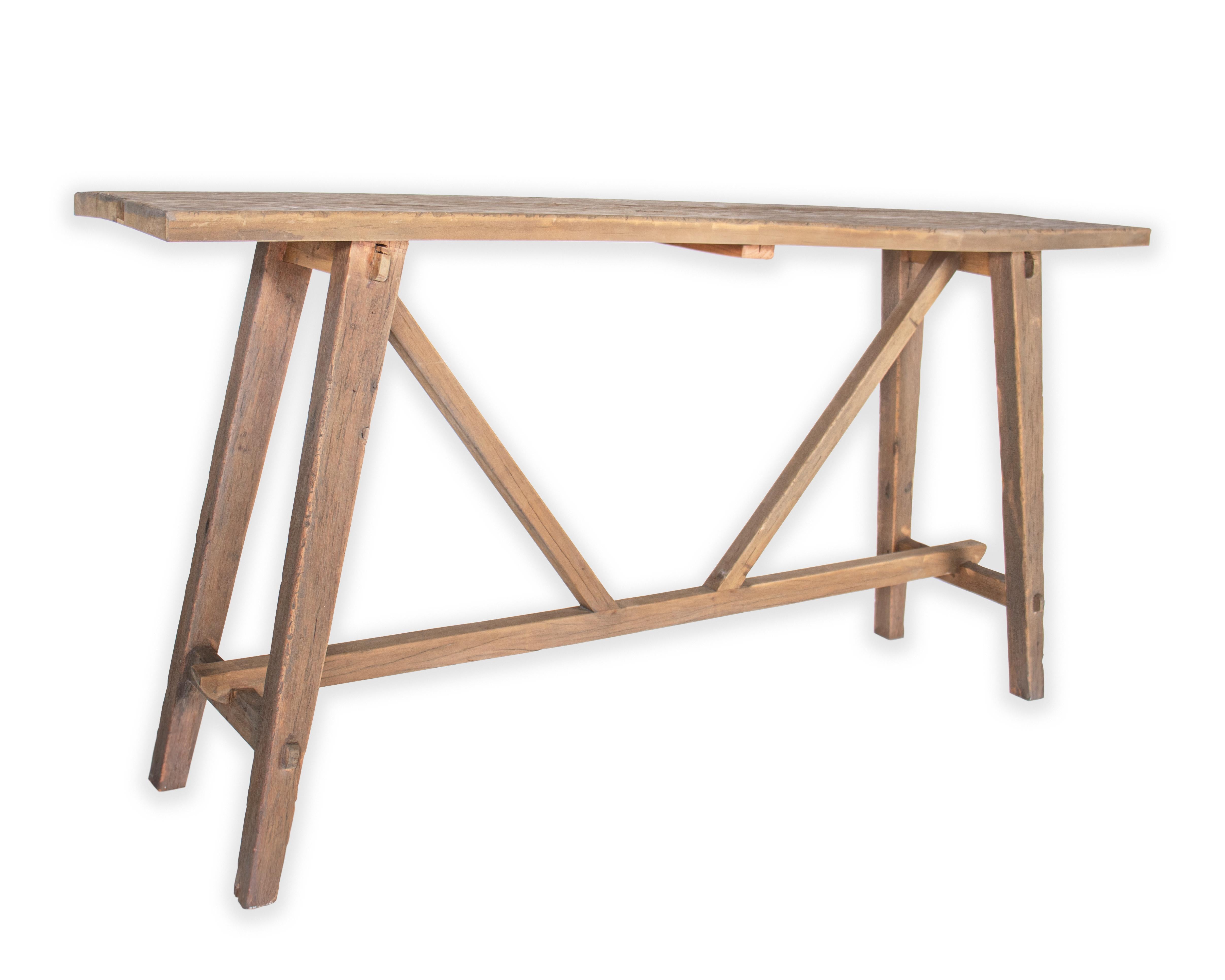 Cross stretcher design console table reclaimed elm. 

Part of our one of a kind Le Monde collection. Exclusive to Brendan Bass.