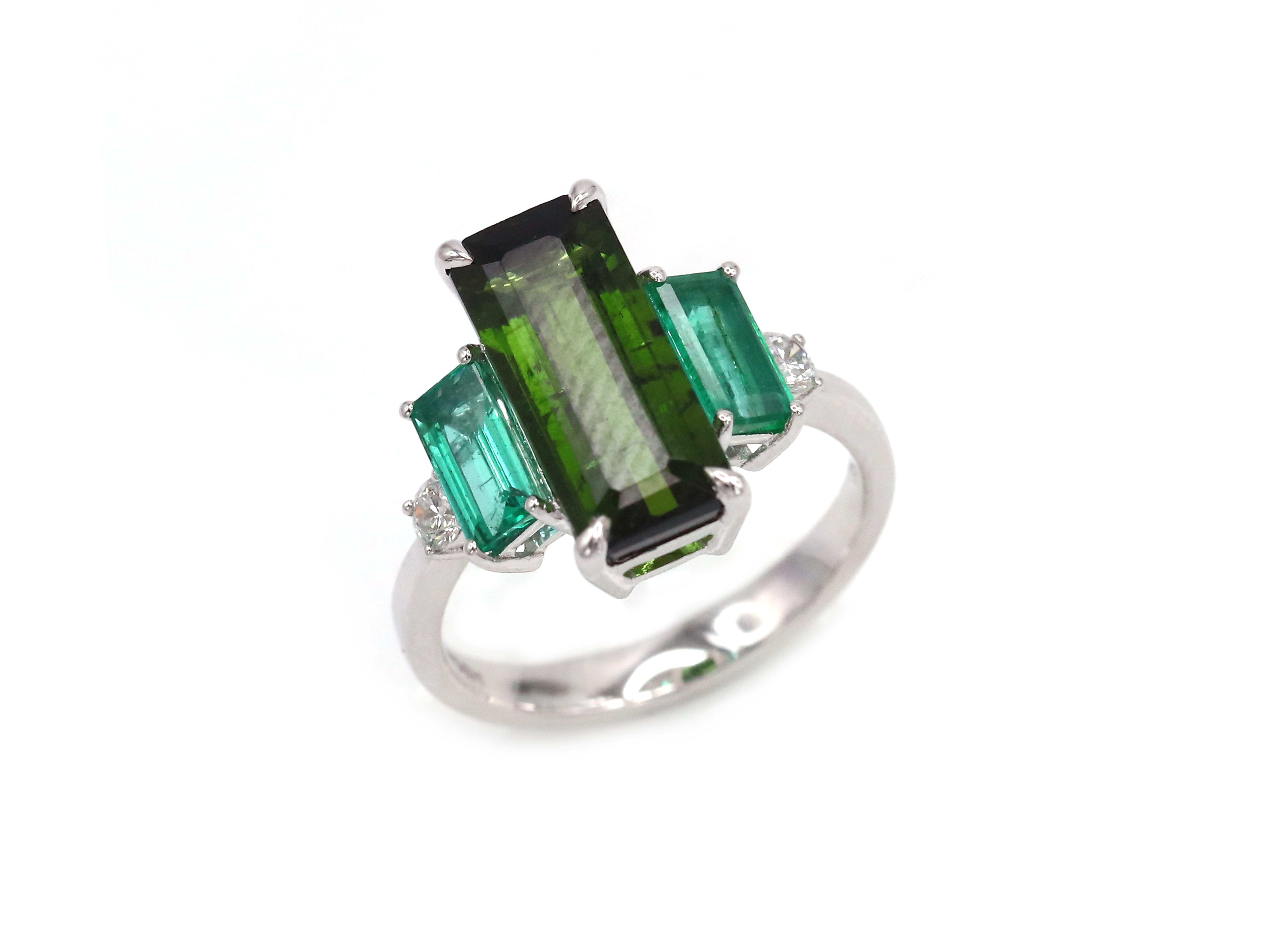 Ring (Matching Earrings Available)

18K White Gold 

Weight 3,58 grams

Emerald 2-1,04 Cts 

Diamond 2-0,17 Cts 

Green Tourmaline -1/4.54 Cts

Size 52

Exquisite 18k white gold dangle earrings feature a captivating ensemble, including six