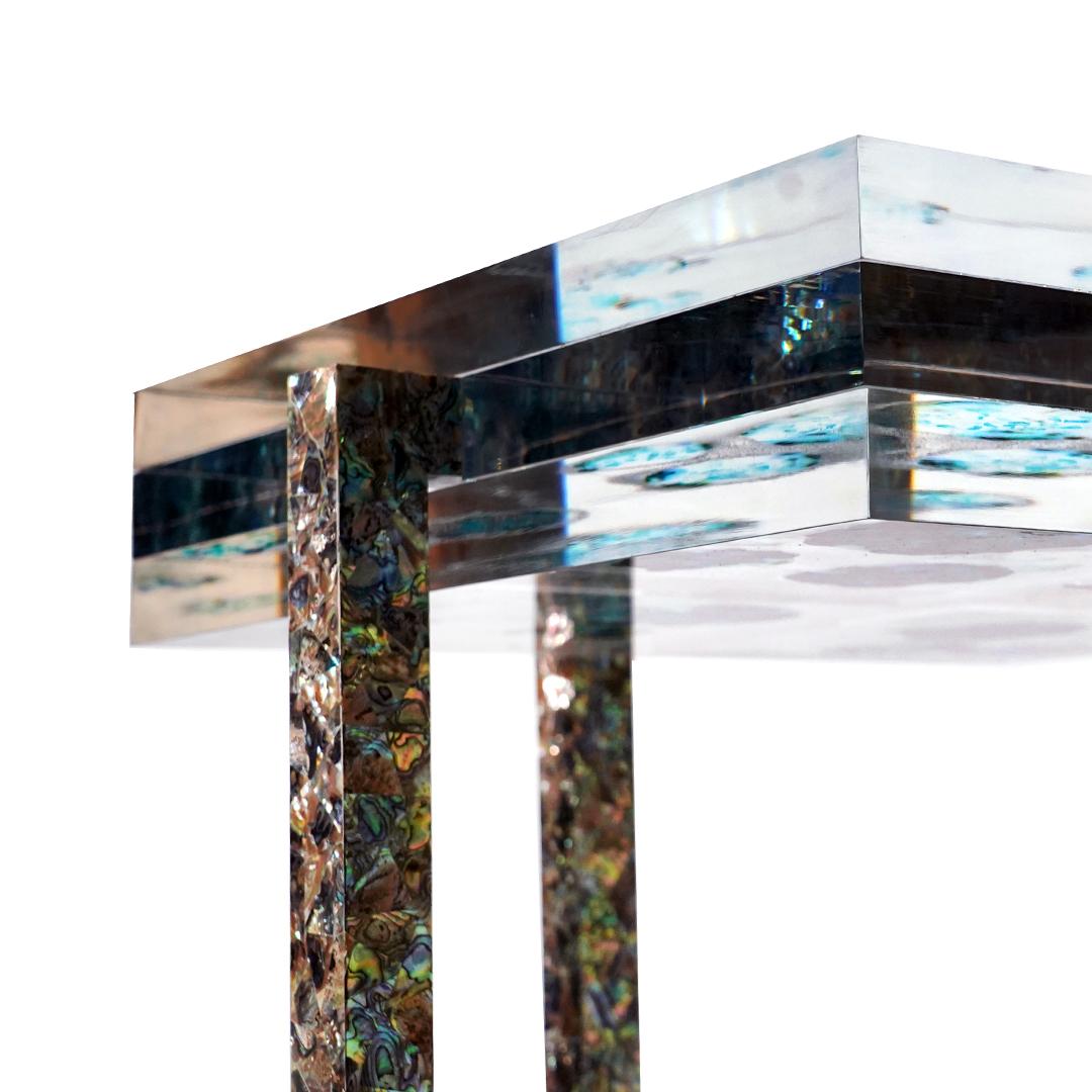 Cross The Sea 2 Side Table by Jean Pascal Levy-Trumet
Limited Edition Of 4 Pieces.
Dimensions: D 60 x W 60 x H 55 cm.
Materials: Metal, polyester, and Abalone mother of pearl.

Available in three different models. Please contact us.

After