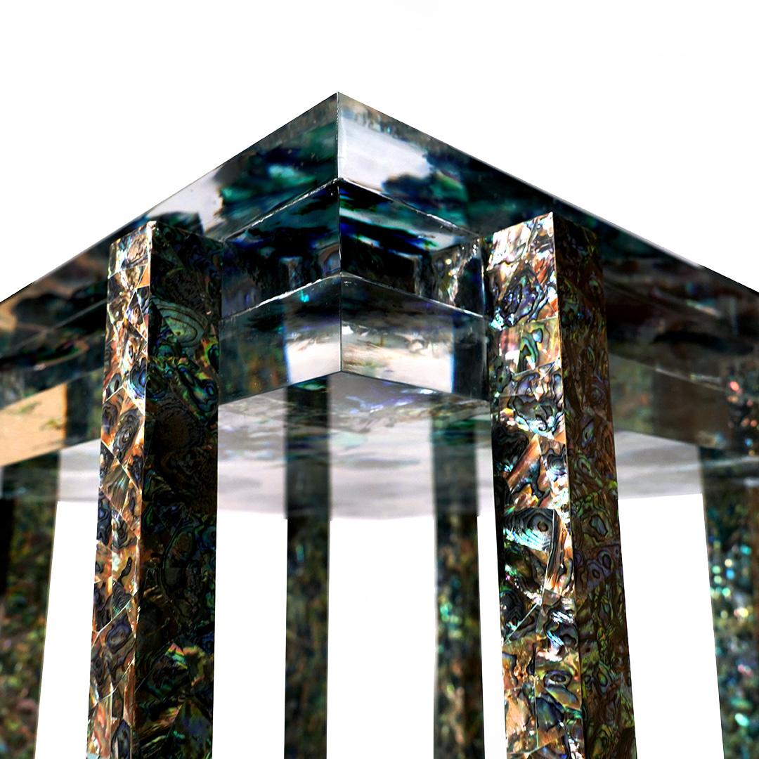 Cross The Sea 3 Side Table by Jean Pascal Levy-Trumet
Limited Edition Of 5 Pieces.
Dimensions: D 60 x W 60 x H 60 cm.
Materials: Metal, polyester, and Abalone mother of pearl.

Available in three different models. Please contact us.

After
