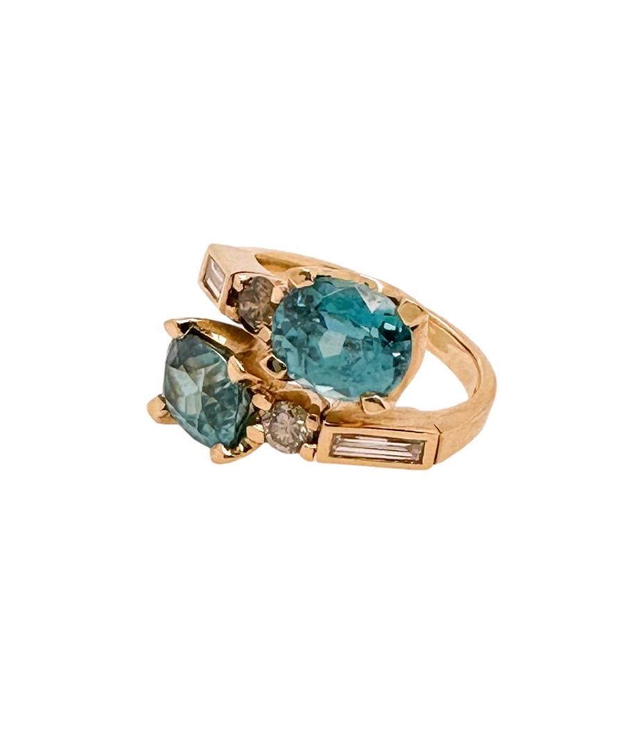 Contemporary Crossover Blue Zircon Ring - 18ct yellow gold with diamonds For Sale