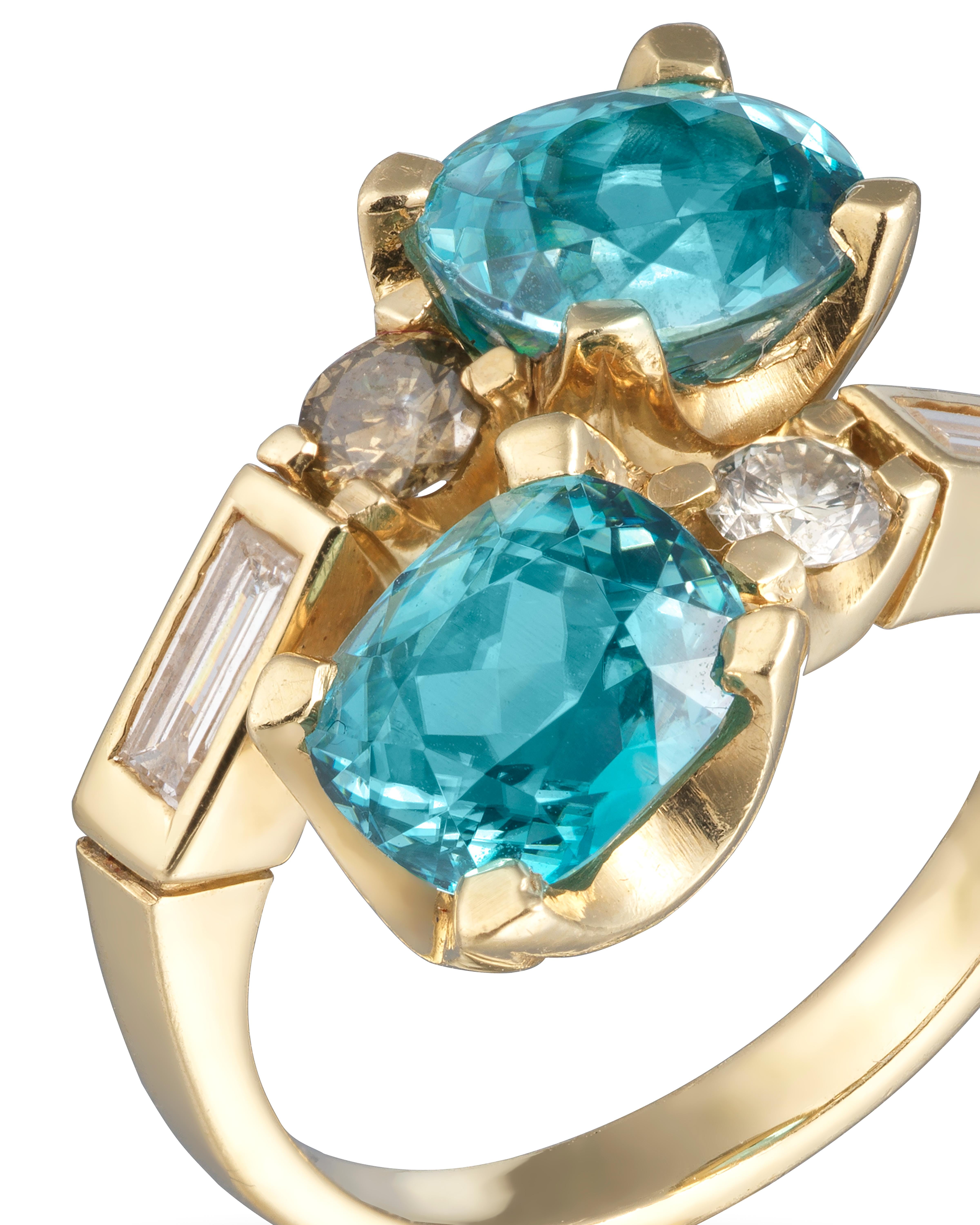 Contemporary Crossover Blue Zircon Ring - 18ct yellow gold with diamonds For Sale