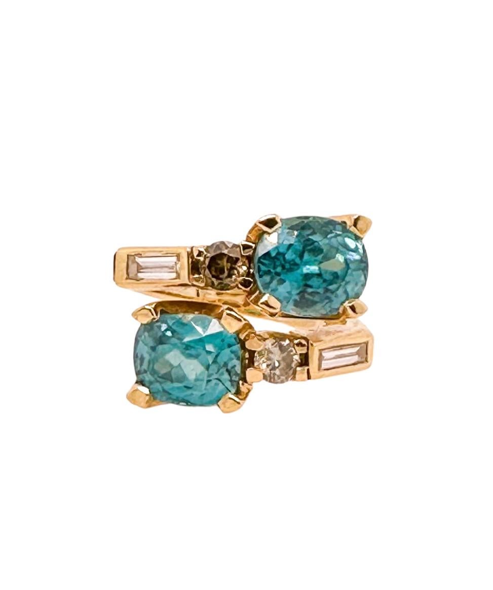Cushion Cut Crossover Blue Zircon Ring - 18ct yellow gold with diamonds For Sale