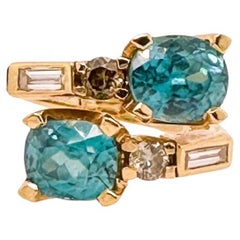 Crossover Blue Zircon Ring - 18ct yellow gold with diamonds