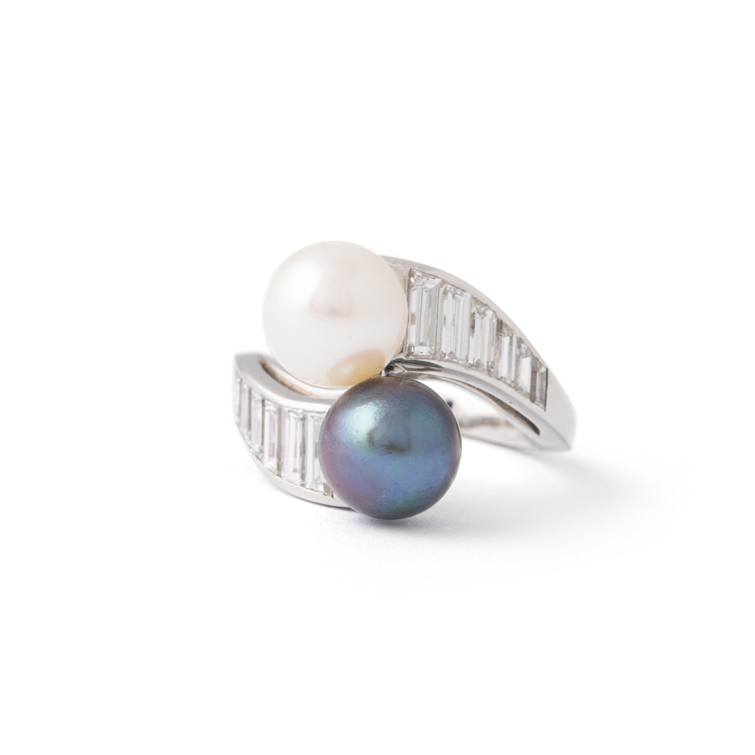 Introducing an exquisite marvel, our Cultured Pearls White and Grey Platinum Ring is a fusion of timeless elegance and contemporary design.

The centerpiece of this ring is a pair of lustrous cultured pearls, each measuring 8.2-8.4 mm in diameter.