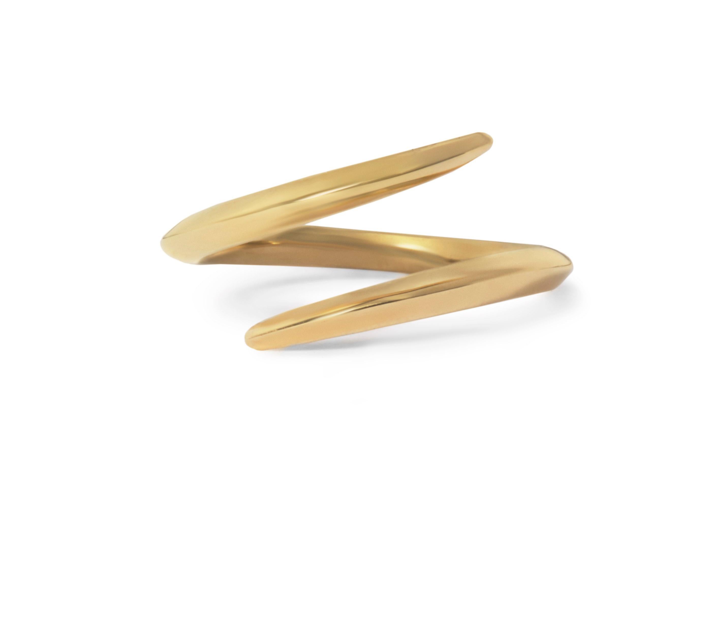 Simple yet unusual, this solid 18-karat gold ring can be worn on its own or stacked with other bands.  The ring curves around the finger and is raised in a subtle, comfortable knife-edge profile for a contemporary take on a moi et toi style.  This