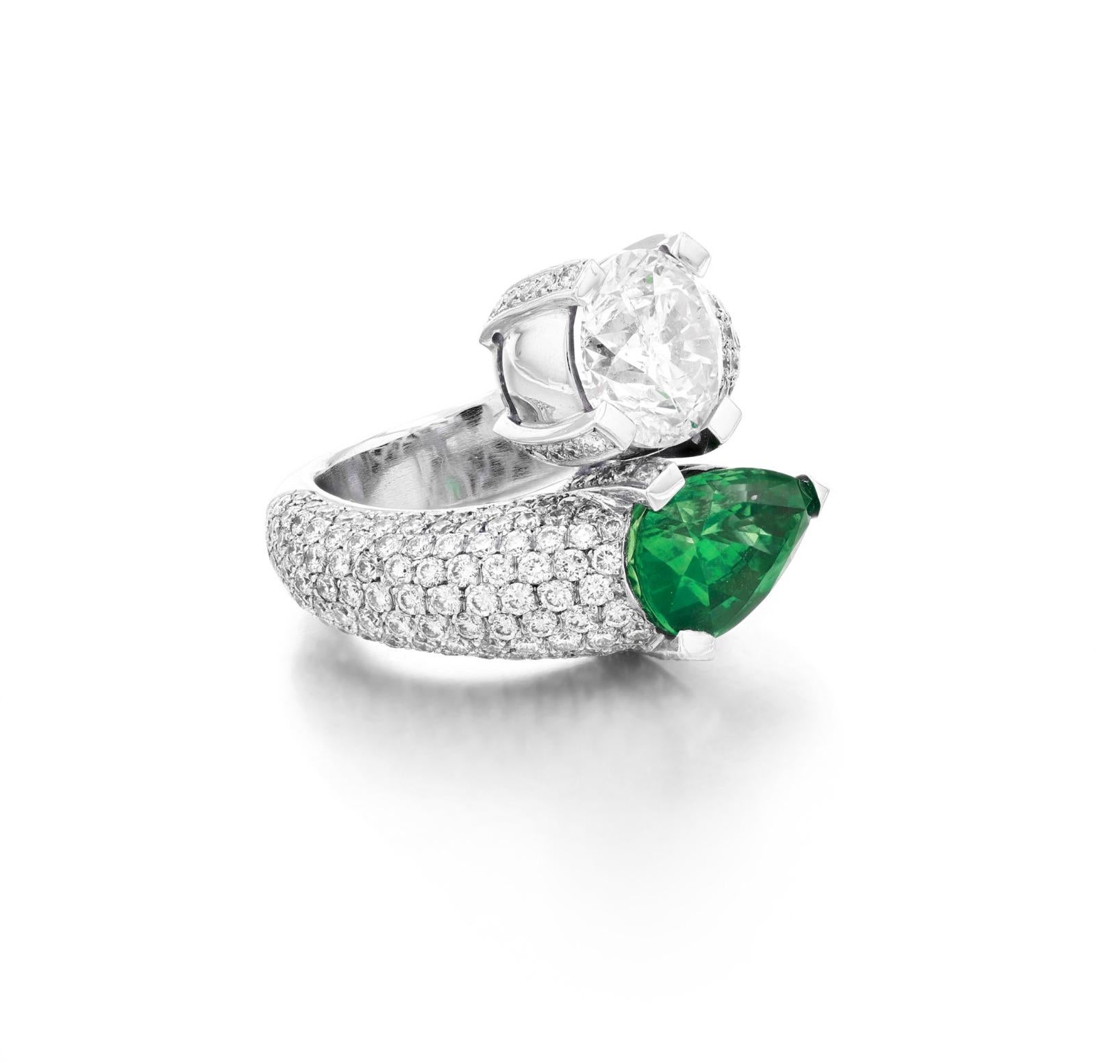 Contemporary Crossover Ring with 5-Carat Pear-Shaped Emerald and Brilliant-Cut Diamond Ring For Sale