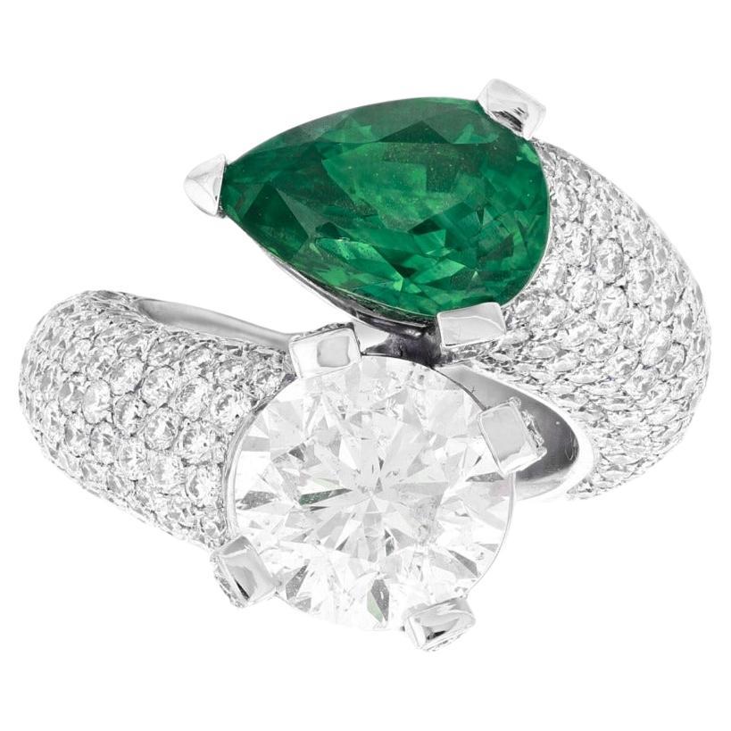 Crossover Ring with 5-Carat Pear-Shaped Emerald and Brilliant-Cut Diamond Ring For Sale