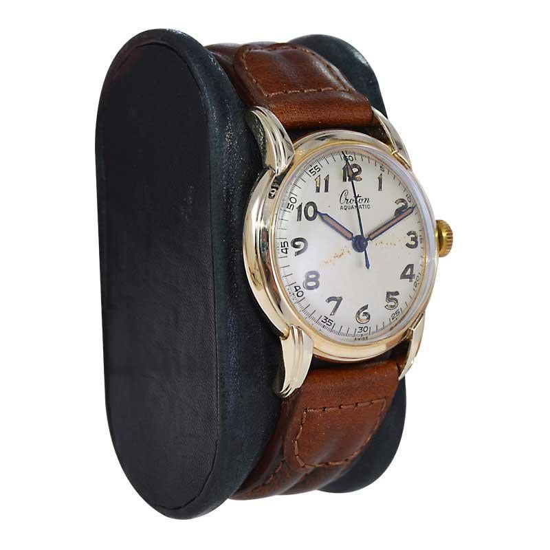 FACTORY / HOUSE: Croton Watch Company
STYLE / REFERENCE: Aquamatic Bumper / Round
METAL / MATERIAL: Yellow Gold Filled 
CIRCA / YEAR: 1940's
DIMENSIONS / SIZE: Length 40mm X Diameter 32mm
MOVEMENT / CALIBER: Automatic Winding / 17 Jewels / Caliber