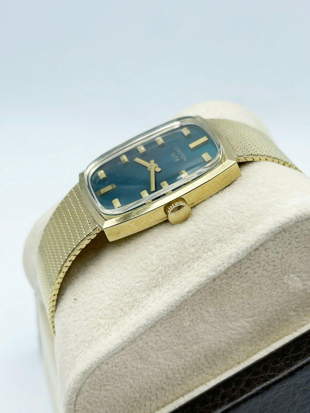 croton 18k gold watch