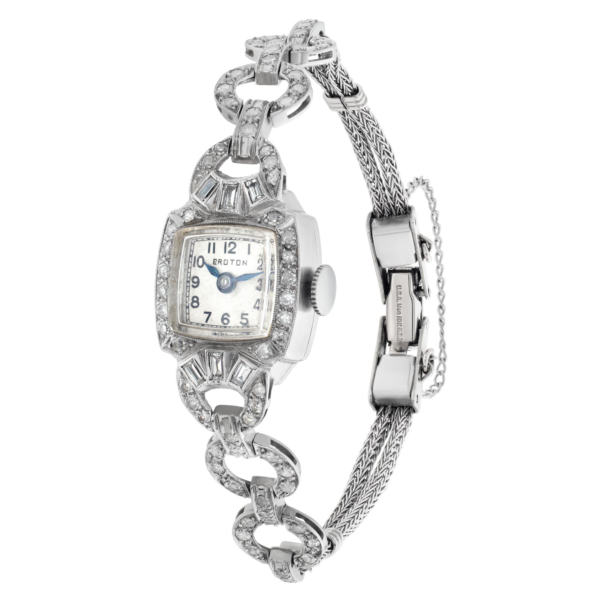 Croton Cocktail watch in platinum & diamond bracelet extensions and then white gold filled bracelet. Approximately 1 carat in G-H color, VS-SI clarity diamonds. Manual. 14.5 mm case size. Circa 1950s. Fine Pre-owned Croton Watch. Certified preowned