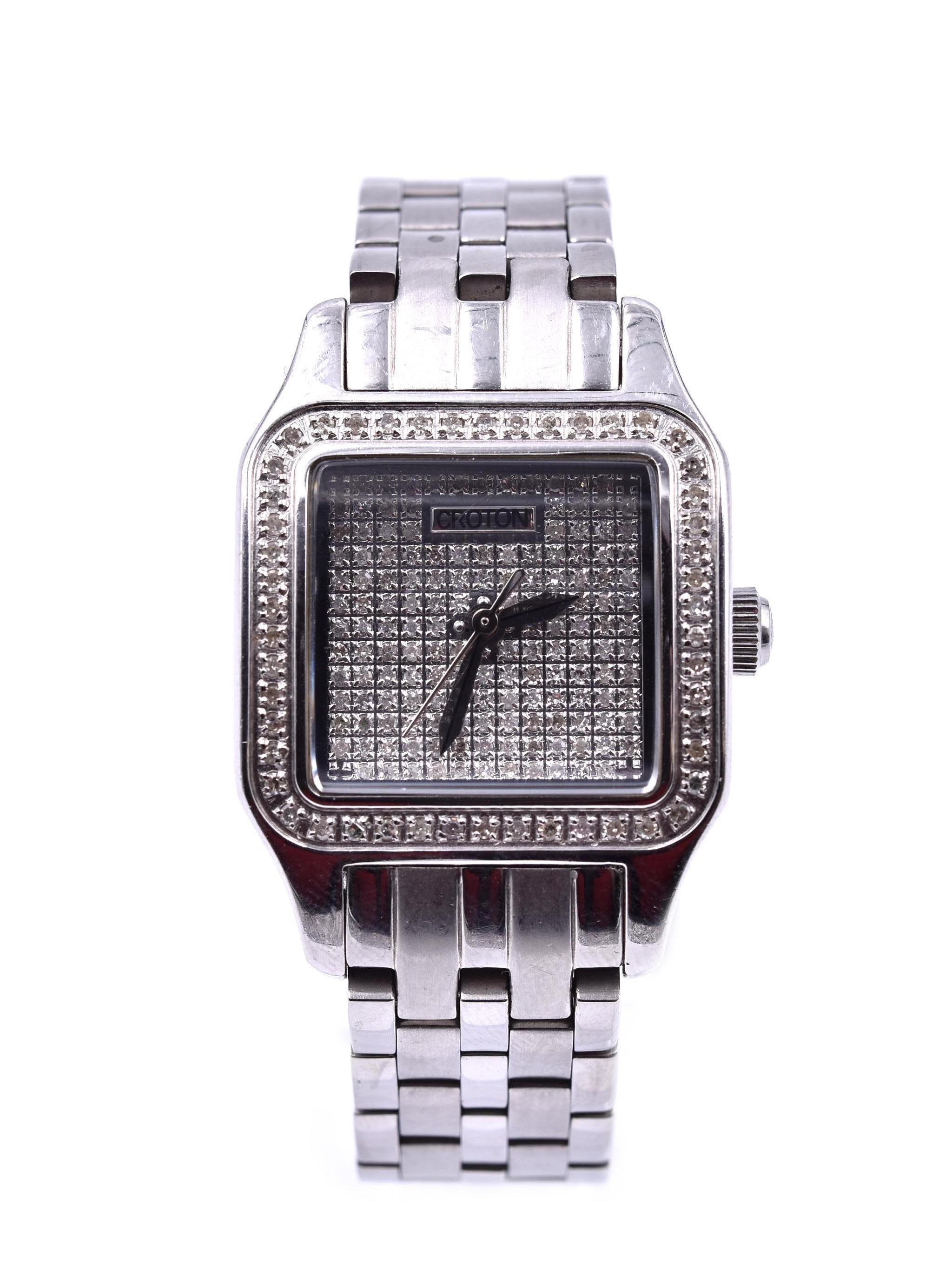 Movement: manual wind
Function: hour, minutes, seconds
Case: square 25mm steel case with genuine diamonds set in bezel & dial, sapphire protective crystal, stainless steel crown, water resistant to 30 meters 
Bracelet: stainless steel link bracelet