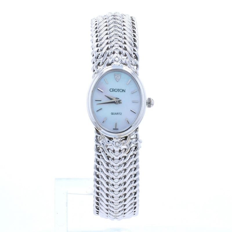 This is an authentic Croton wristwatch. The watch comes with a one-year warranty.

Brand: Croton 
Metal Content: 14k White Gold
Stone Information:
Genuine Mother of Pearl (dial)
Movement: Quartz 
Number of Jewels: 4
Case: 17.5mm wide (not including