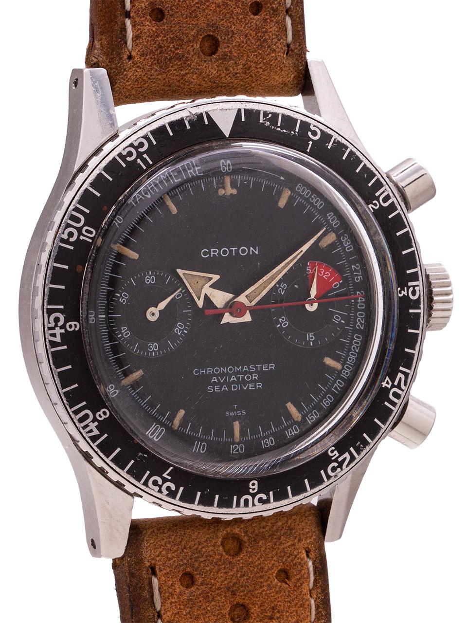 
Very nice example Croton 2 registers manual wind “Chronomaster Aviator Sea Diver” chronograph circa 1960’s. Featuring a 38 x 44mm case with extended lugs, screw down caseback, wide elapsed time bezel indicating hours and minutes, and with original