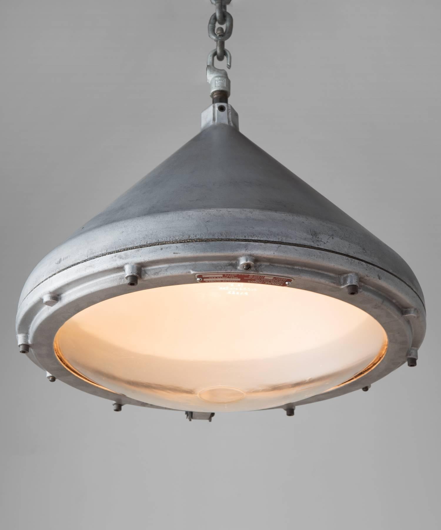 Crouse-Hinds aluminium pendant, America, circa 1950

Generous, industrial form with luminous Pyrex lens hinged to aluminum fitter. Includes manufacturer's seal.

Measures: 17.5
