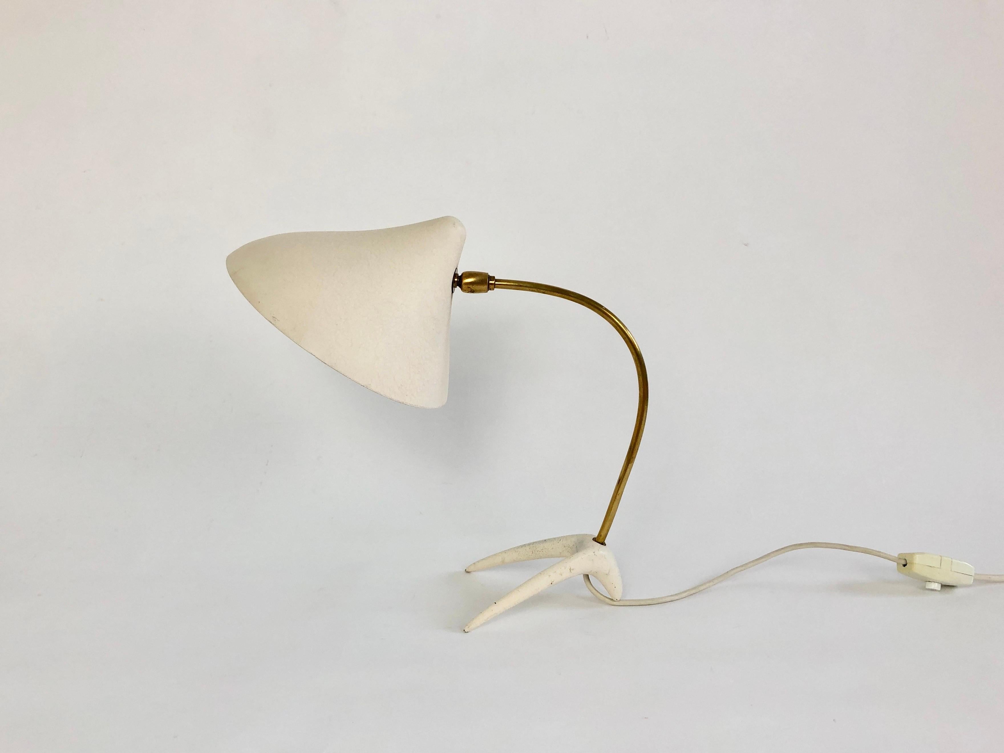 Crow's Foot table table lamp by German lighting company Cosack.

Often (mis)attributed to Louis Kalff and Philips (Philips never designed a crows foot lamp, Kalff never designed for Cosack).

Original white crackle effect painted shade and