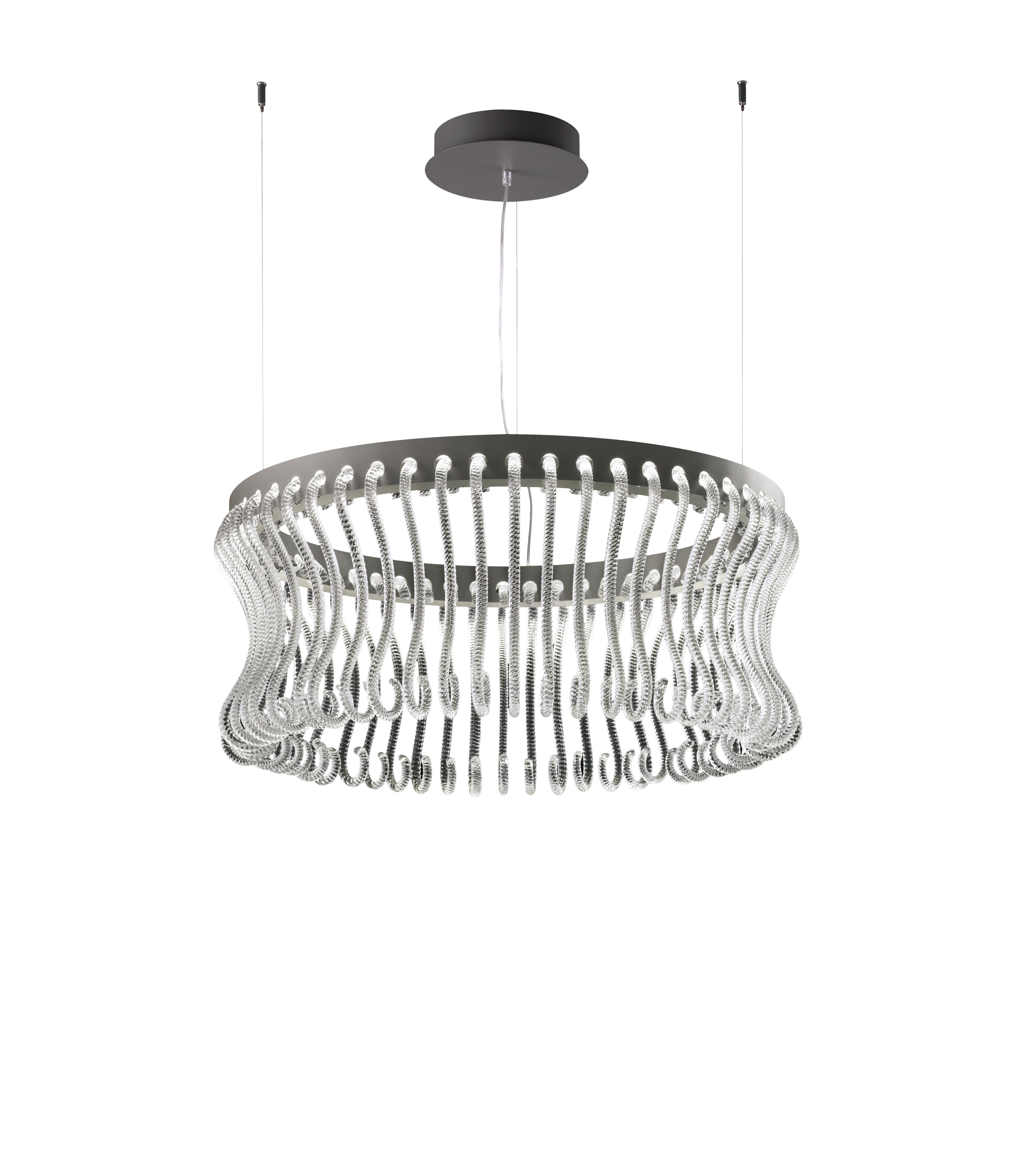 Originally designed in 2017 by Brian Rasmussen, here you are shown the Crown 7335 Suspension Lamp in Crystal Glass and Painted Grey Finish. The pastoral is a full-glass decorative element, characteristic of the Venetian chandelier which has become
