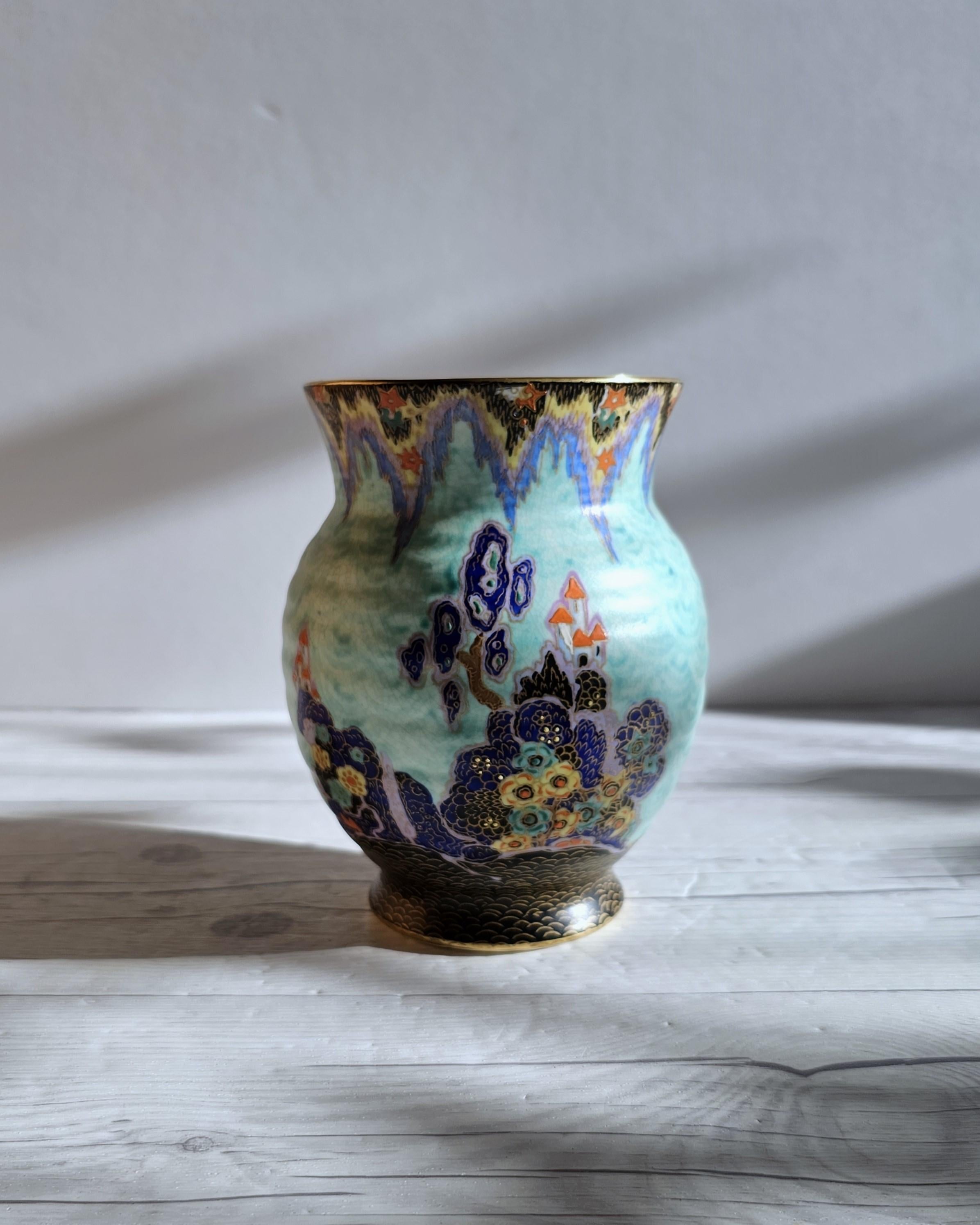 This elegantly diminutive and subtly exquisite, handpainted work of late Art Deco design is by Enoch Boulton for the British Pottery Crown Devon. The baluster form is an excellent canvas for the semi-matt, satin glaze décor. The base glaze is a tone