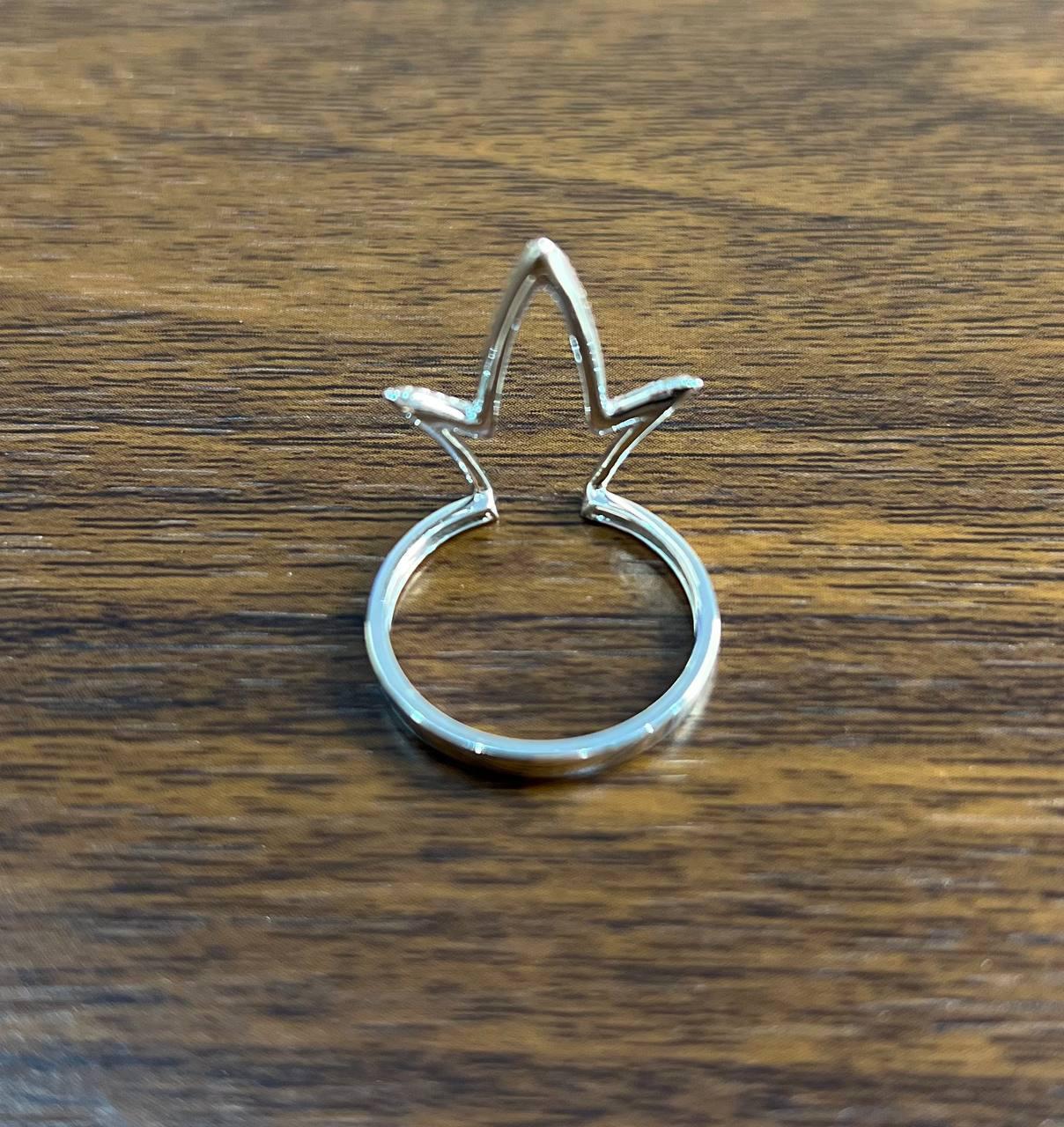 This modern ring is crafted in 14K White Gold. It features a unique geometric design with two intersecting arcs adorned with small, sparkling diamonds of 0.25 carats of G/VS Quality. The arcs create a striking, openwork pattern.