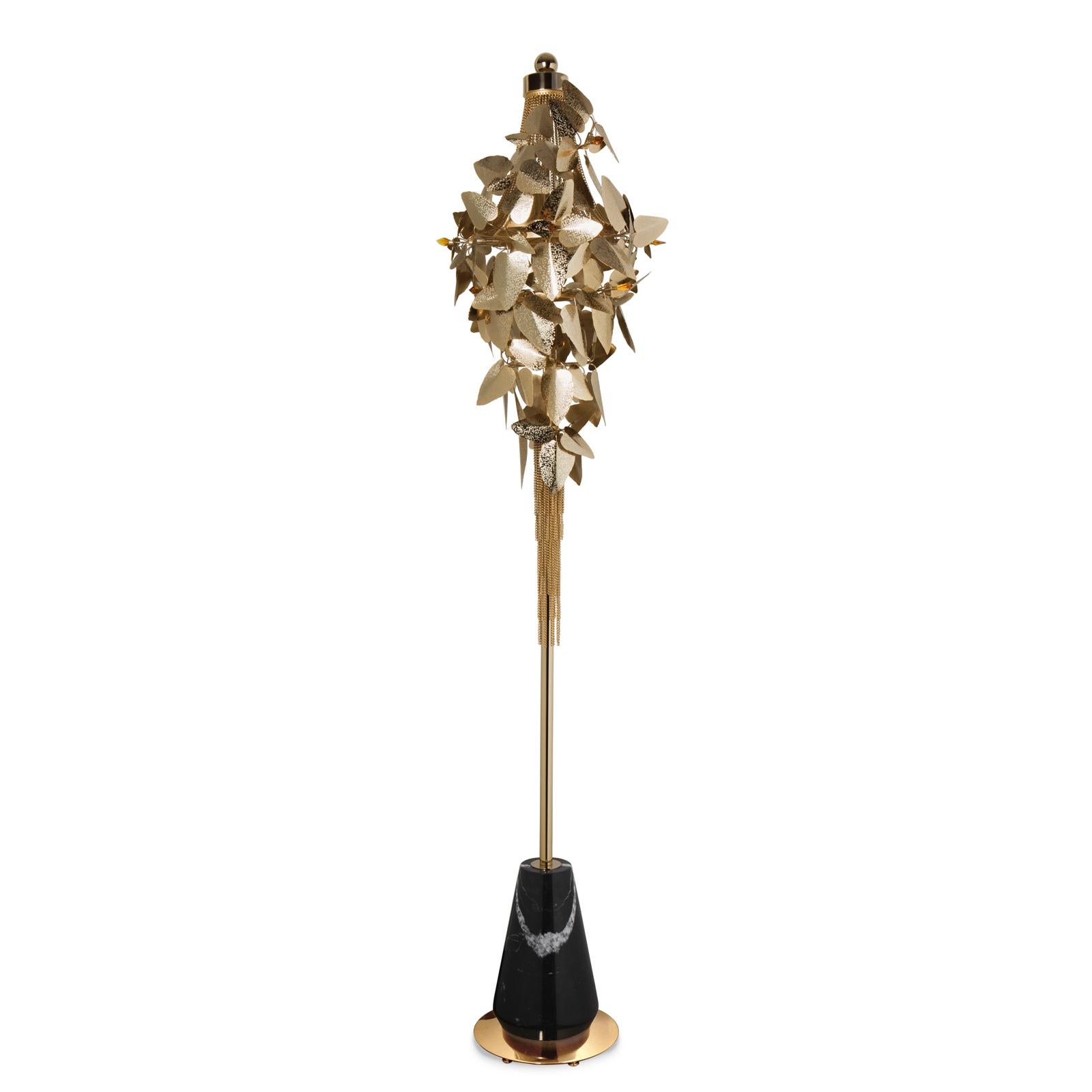 Floor lamp crown leaves with Swarovski crystal.
Leaves in gold plated hand-hammered with amber Swarovski crystals. 
With a black marble and polished brass base. Subtle piece.
