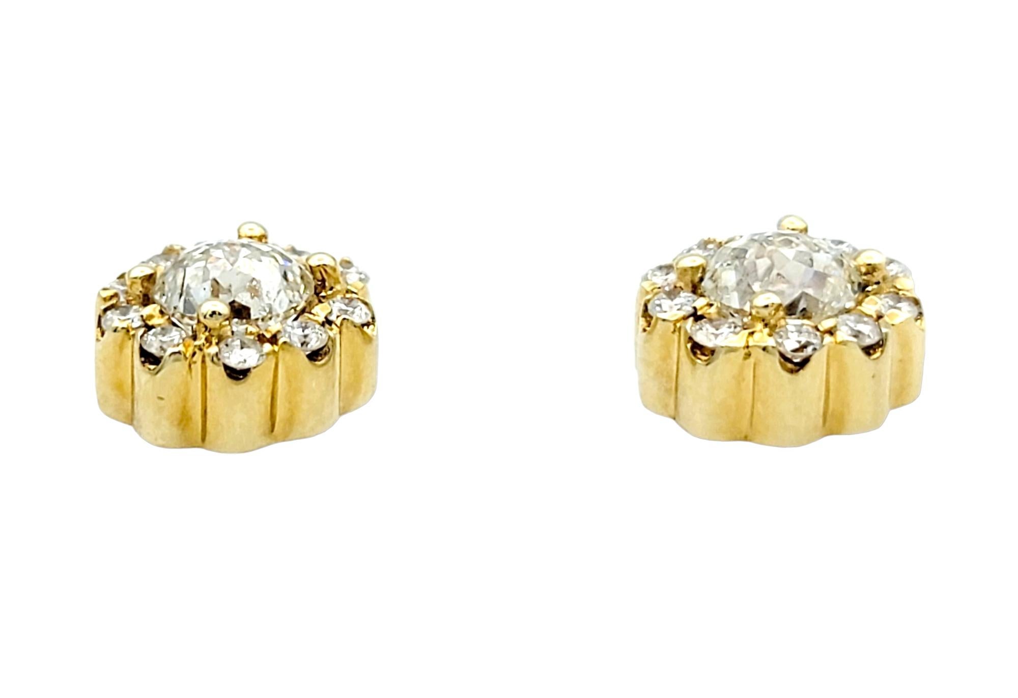 Elegance and brilliance converge in this sparkling pair of stud earrings, expertly crafted in lustrous 18 karat yellow gold. Each earring features a captivating 