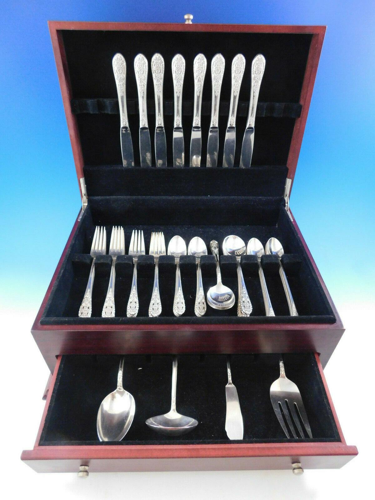Crown princess by International sterling silver flatware set, 52 pieces with unique pierced floral handles. This set includes:

8 knives, 9 1/4