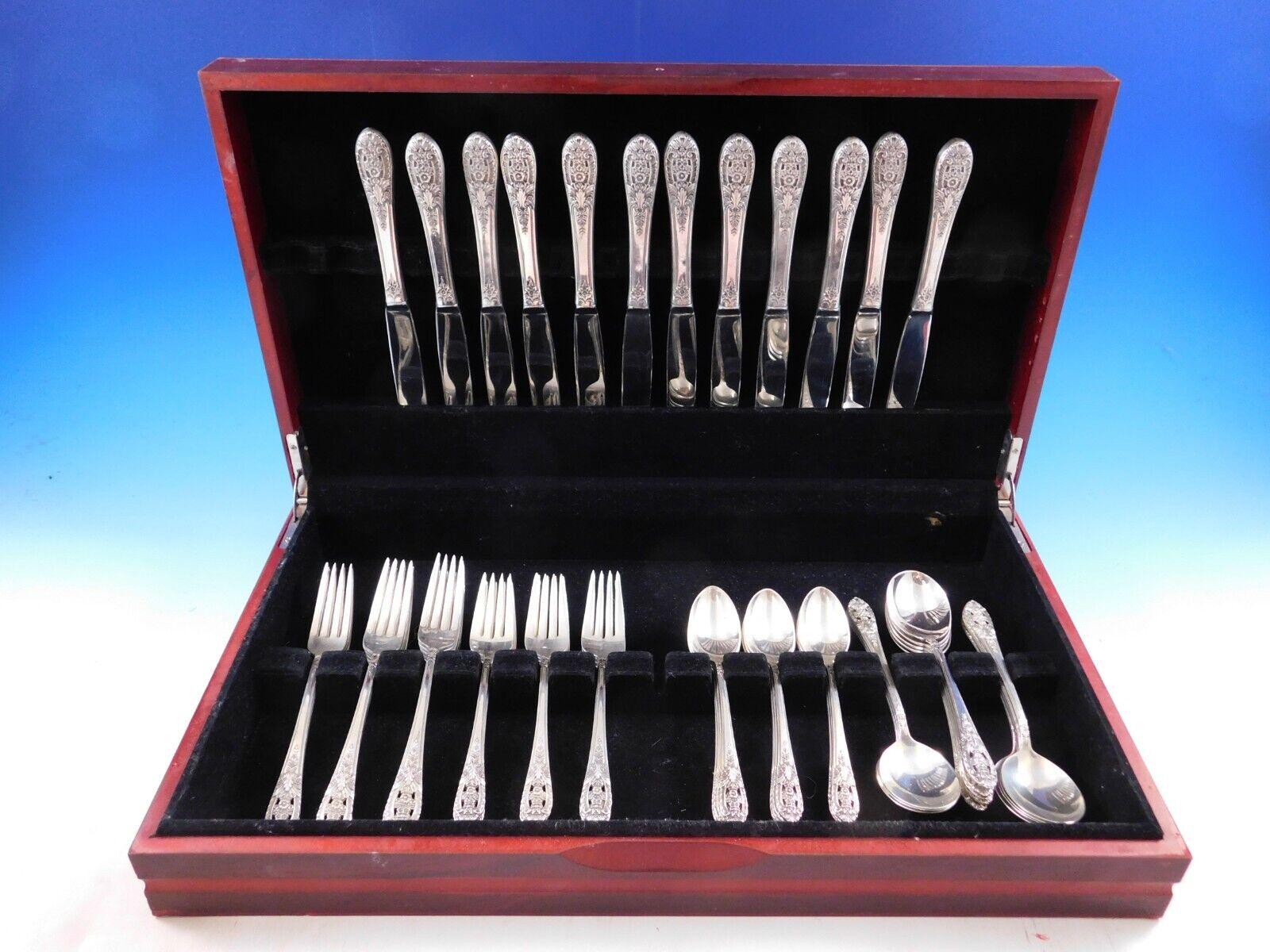 Crown Princess by International / Fine Arts sterling silver Flatware set - 60 pieces with unique pierced floral handles. This set includes:
 
12 Knives, 9 1/4
