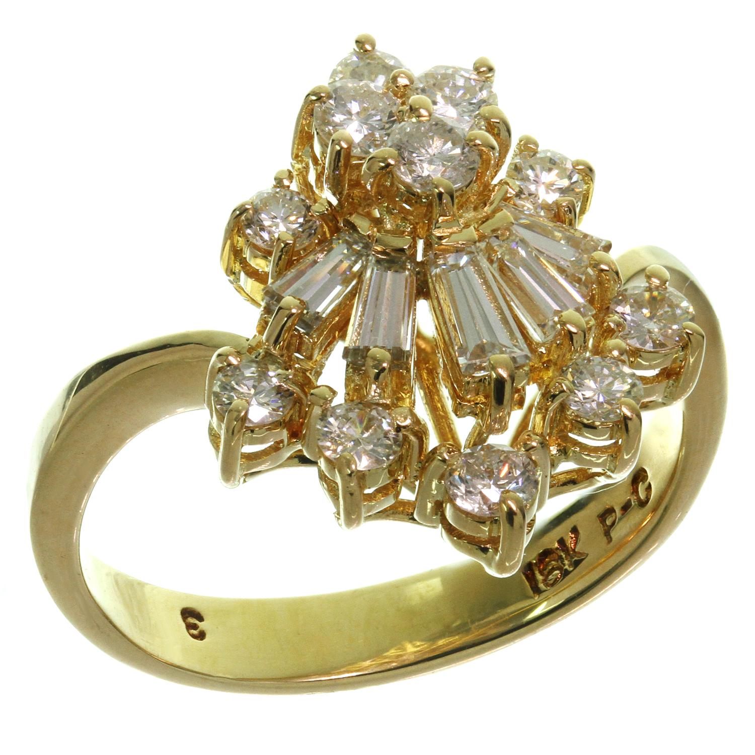 This classic estate women's ring features an elegant crown-shape crafted in 18k yellow gold and set with G-H VS2-SI1 diamonds weighing an estimated 1.11 carats Made in United States circa 1980s. Measurements: 0.55