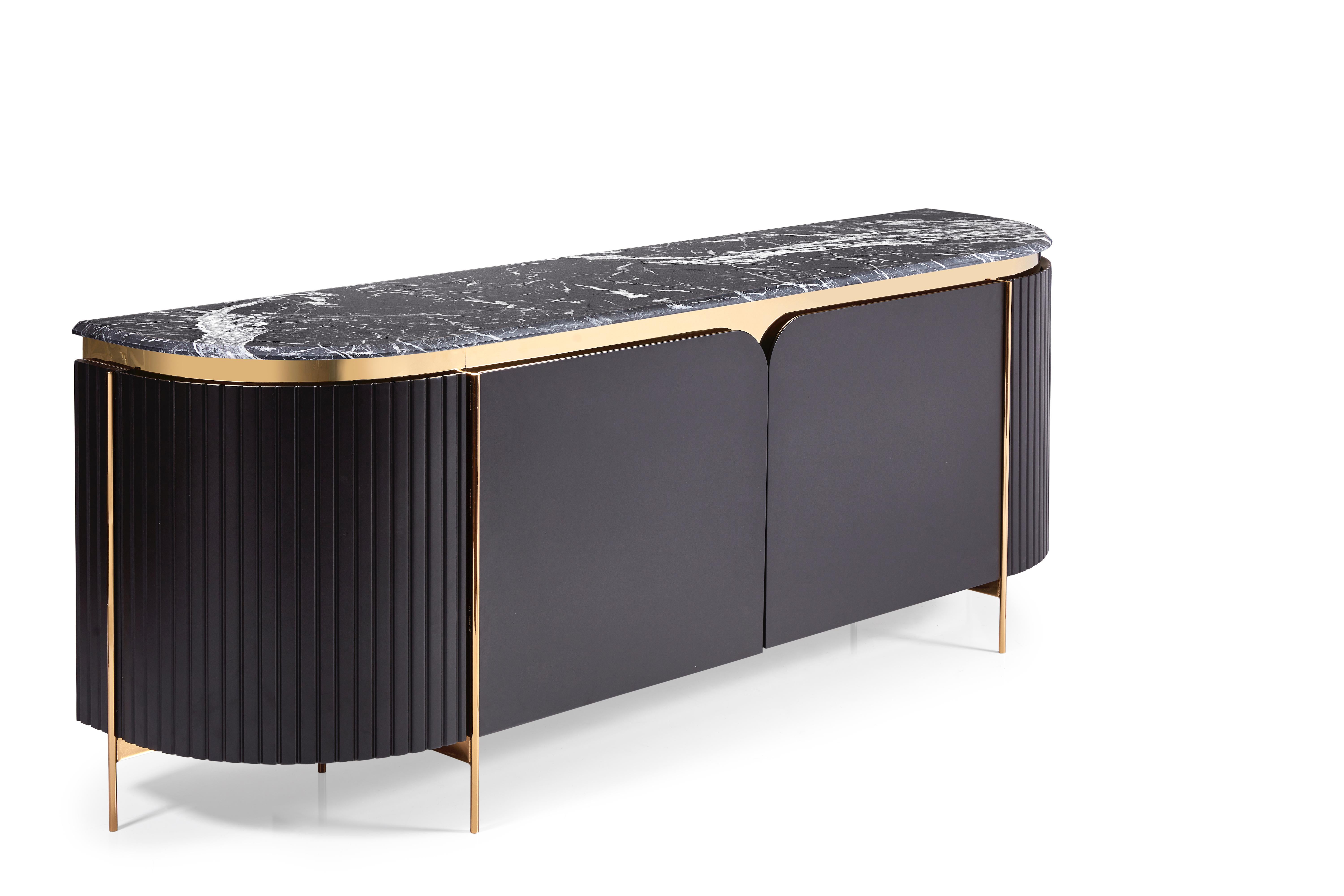Make a statement with this deco infused console that is anything but ordinary. Hand carved side channel details accented with bronze creates the illusion of a substantial cabinet floating on thin tapered metal legs.
