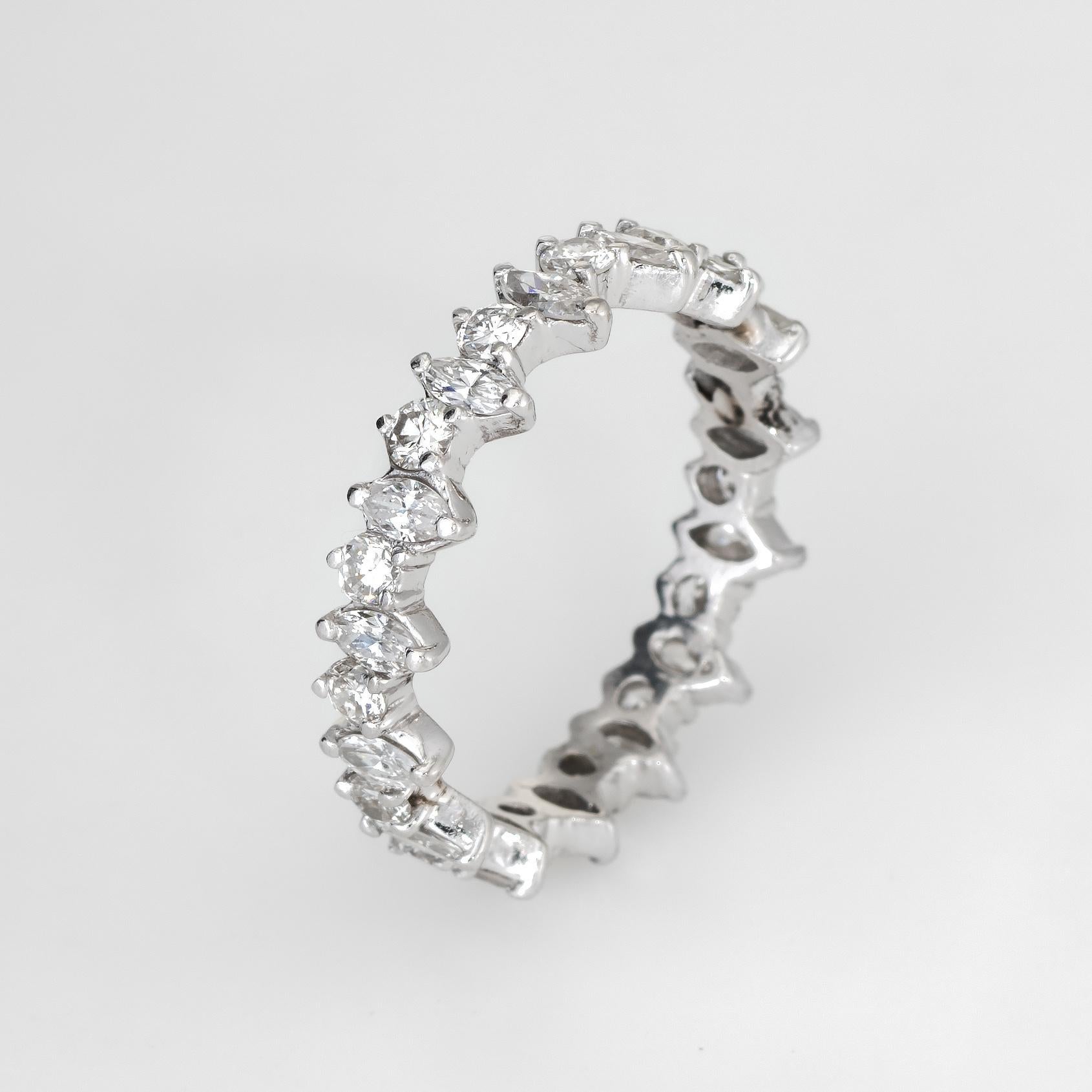 Finely detailed vintage eternity ring, crafted in 18 karat white gold. 

Marquise and round brilliant cut diamonds are estimated at 0.04 to 0.05 carats each and total an estimated 1.35 carats (estimated at G-H color and VS2 clarity).    

The