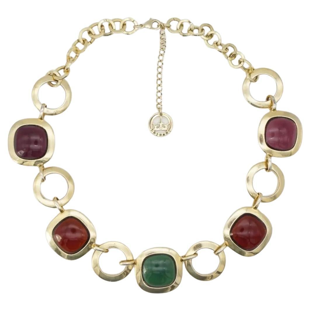 Crown Trifari 1950s Gripoix Purple Amber Green Round Interlock Pendant Necklace, Gold Tone

Very good condition. Very light scratches or colour loss, barely noticeable. Rare to find. 100% Genuine. 

A very beautiful necklace, signed at the