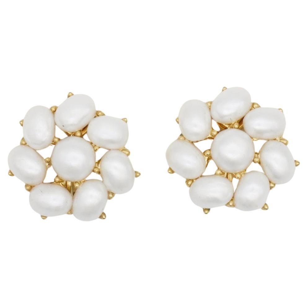 Crown Trifari 1950s White Oval Round Pearls Swirl Flower Openwork Clip Elegant Earrings, Gold Tone

Very good condition. A very beautiful earrings, signed at the back. 100% genuine.

Material: Gold plated metal, Faux pearls. 

Size: 2.0*2.0