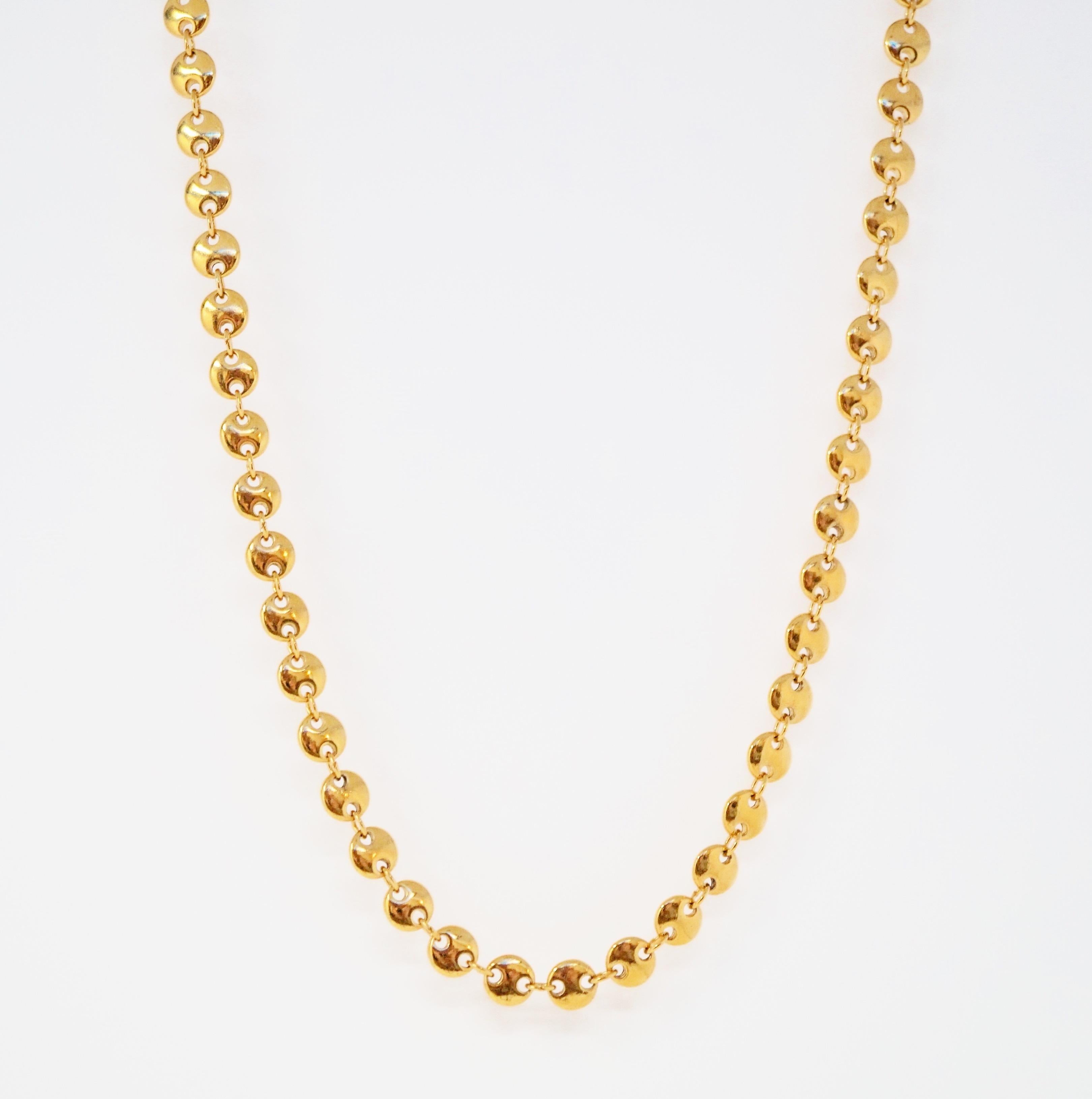 Stunningly beautiful gold-tone coin disc necklace by Trifari, circa 1955. Trifari is a highly collected costume jewelry brand, noted for it's high quality of construction and intricate details. This piece has a gold tone 
