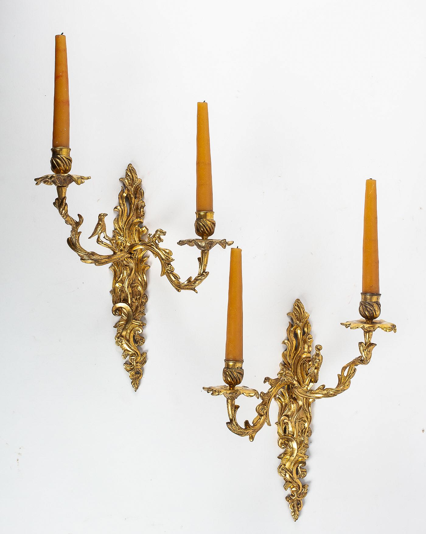 The crowned C Mark, rare pair of Hunting design Ormolu Louis XV period sconces, circa 1745-1749.

A rare and elegant pair of hunting design chiseled gilt-bronze sconces, one decorated with foliage, dog and bird, and the other decorated with leaf,